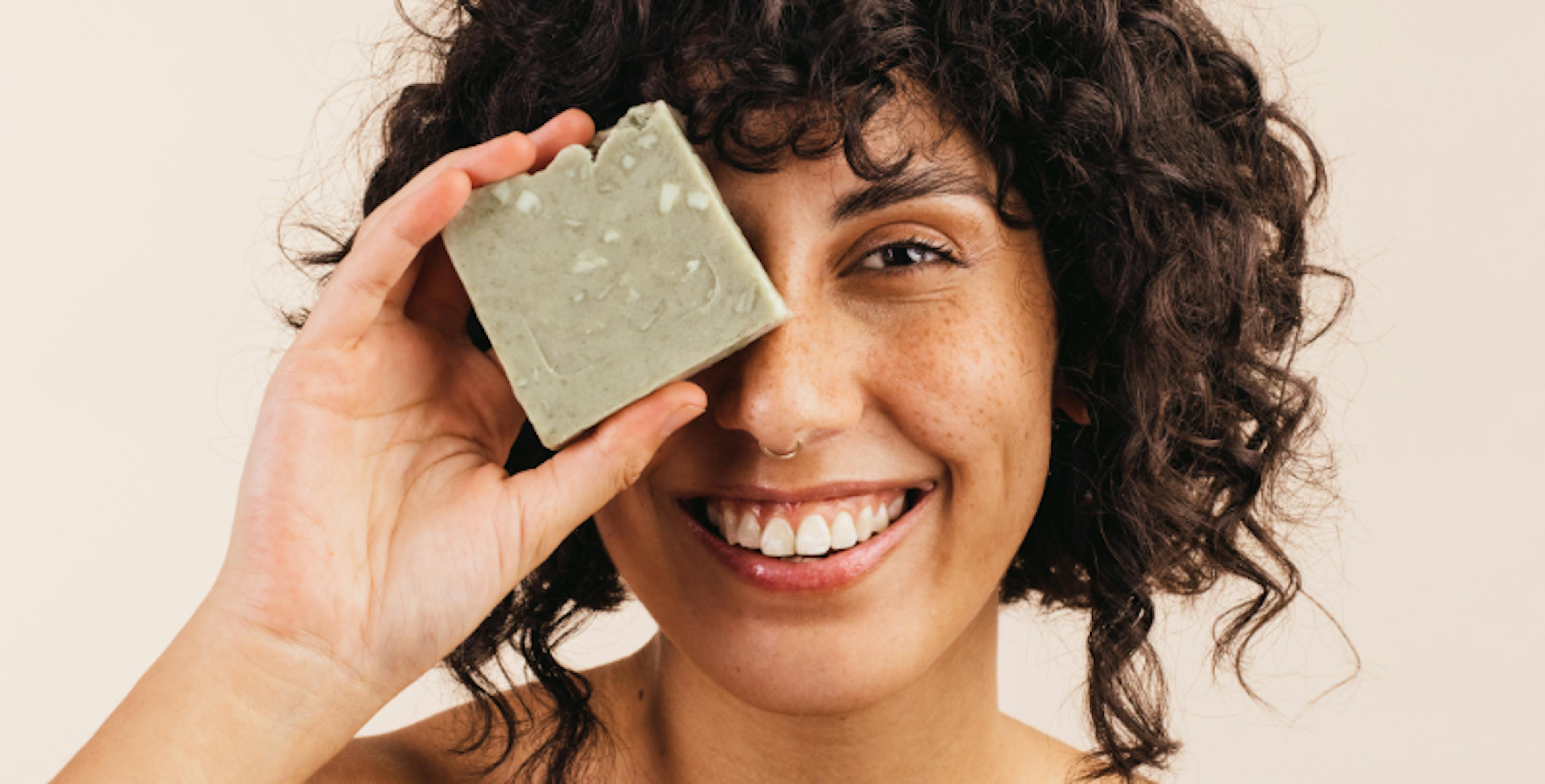 Woman holding bar of soap