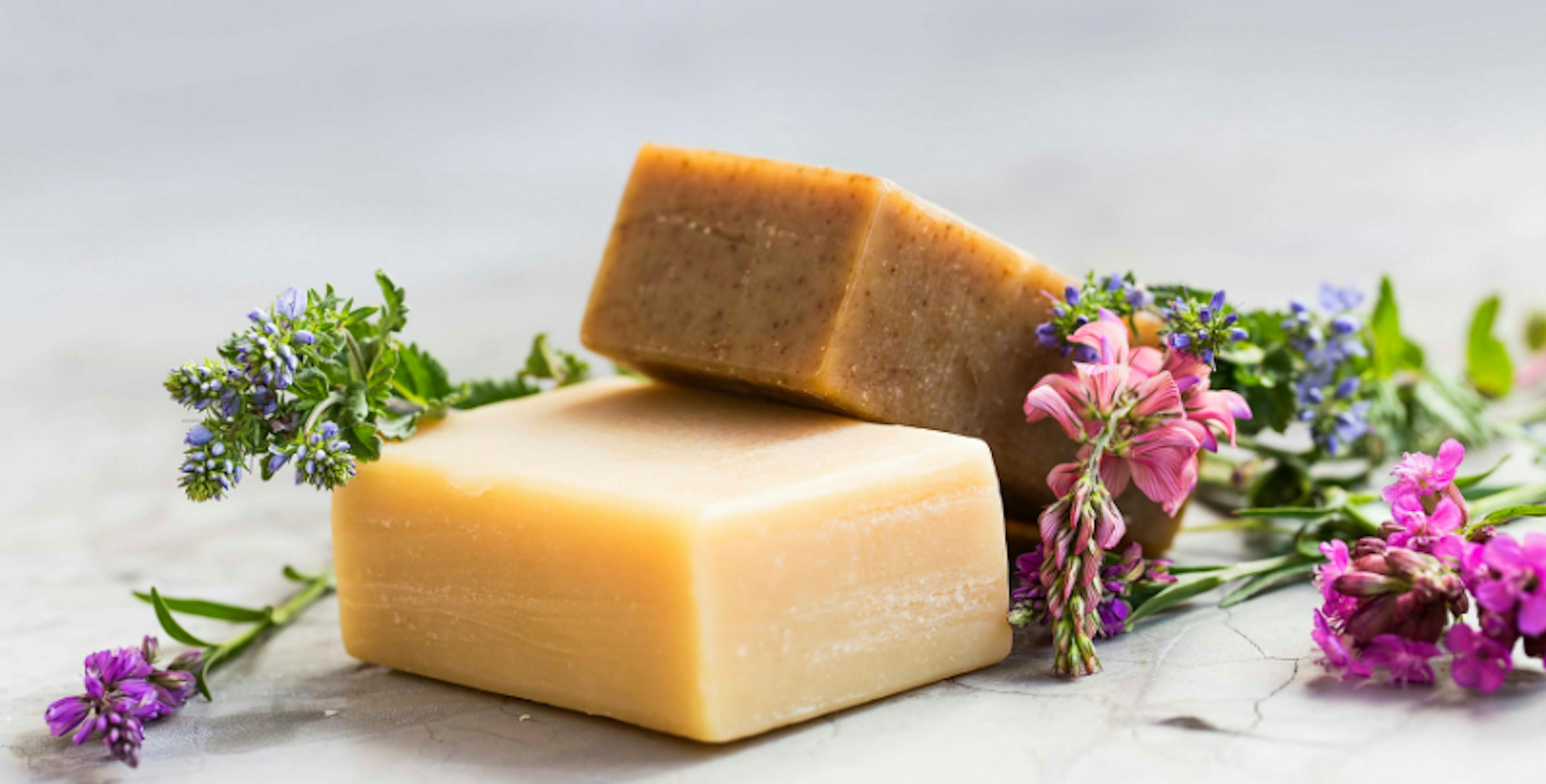 Bars of soap resting with flowers