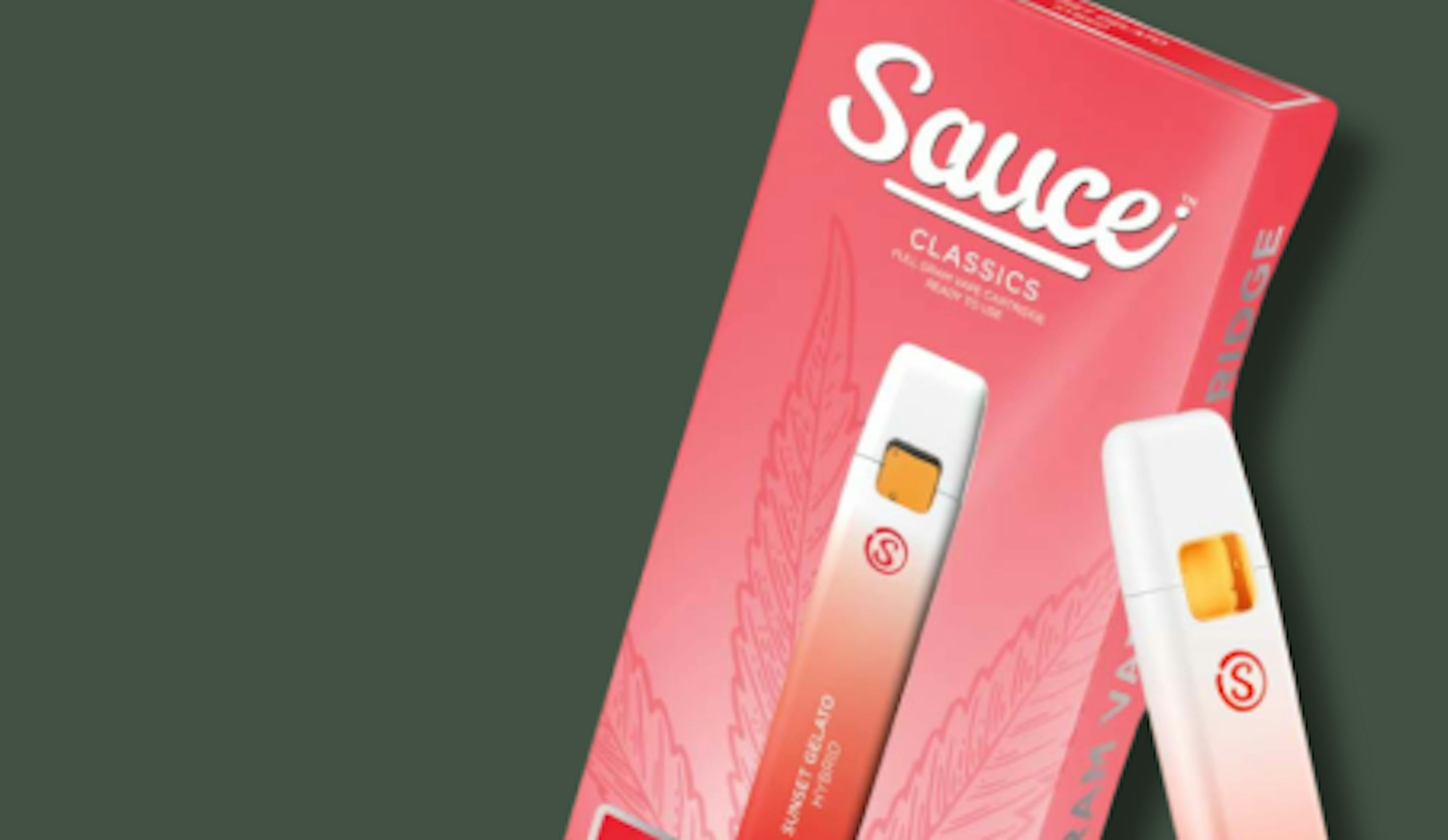 Sauce Essentials vape packaging with a disposable vape pen in the Sunset Gelato flavor, featuring a gradient pink and white design with cannabis leaf graphics, displayed on a dark green background.

