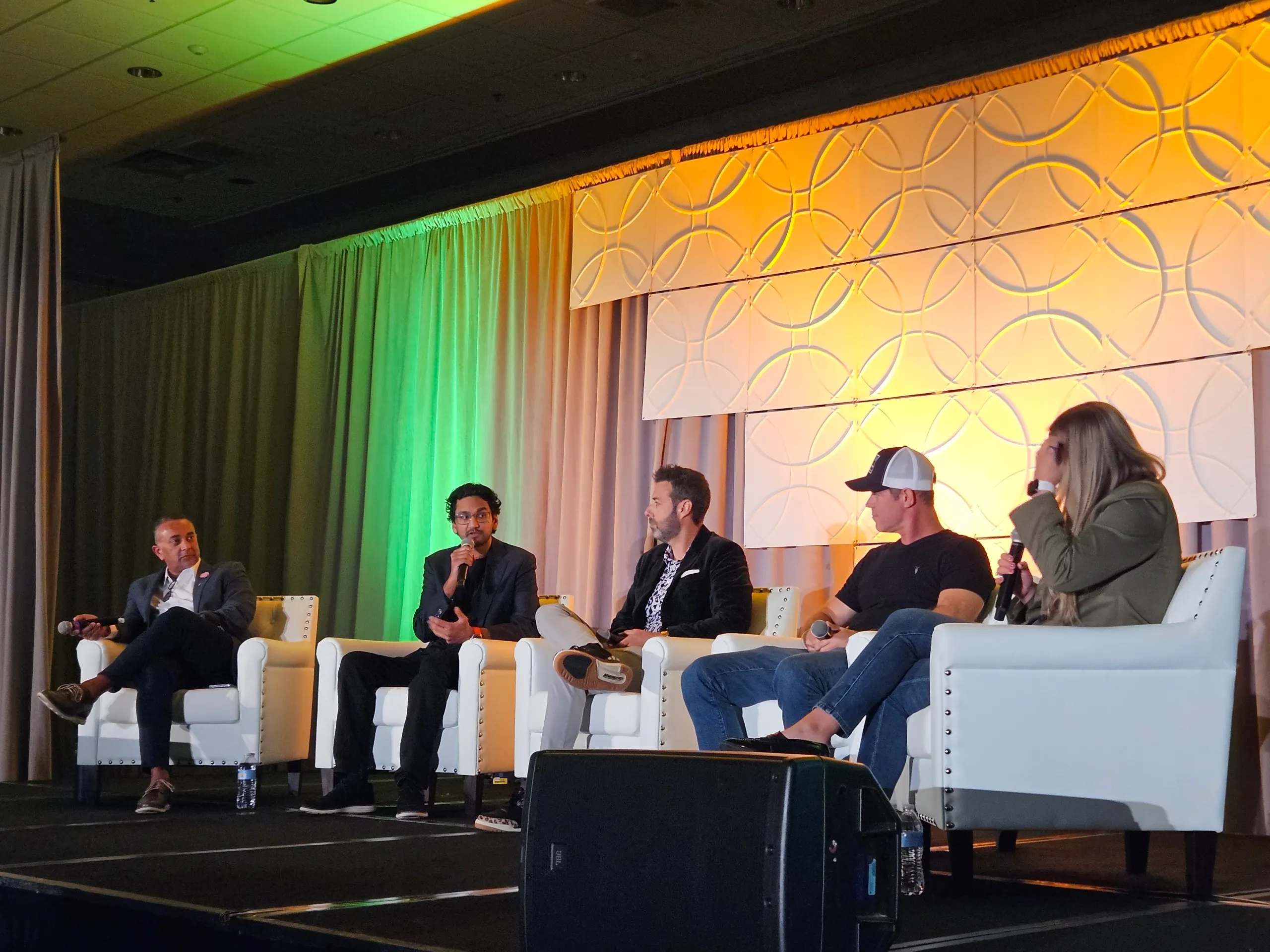 Cannabis professionals speaking on a panel at the Benzinga Cannabis Conference in Chicago.