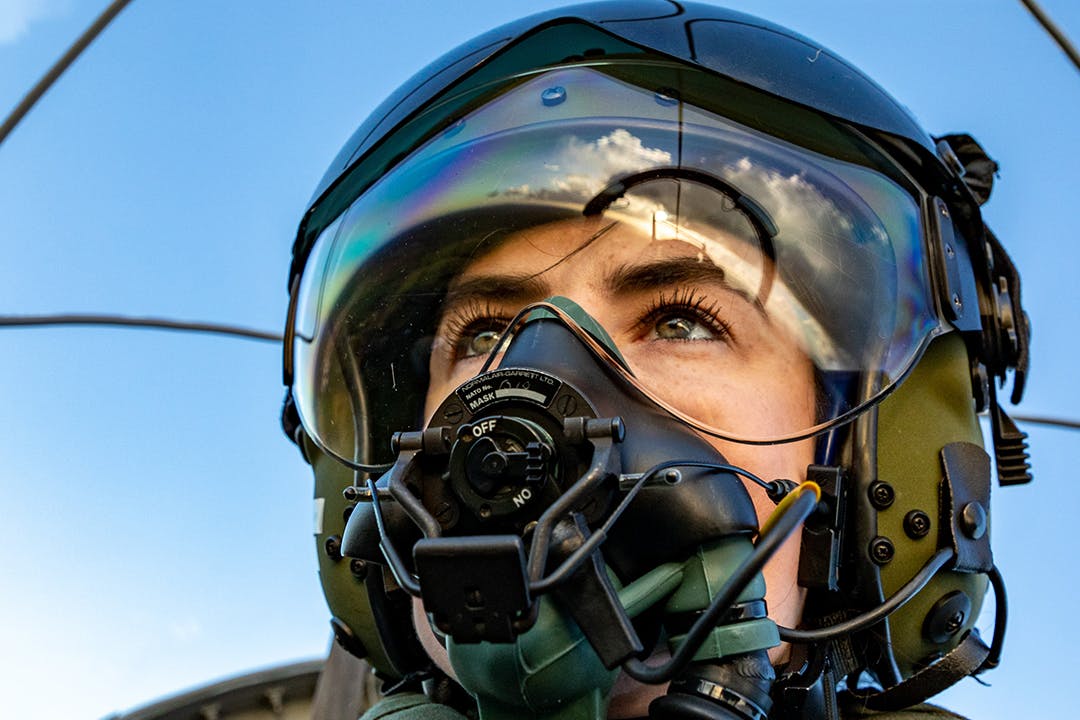 Fighter pilot with a helmet on.