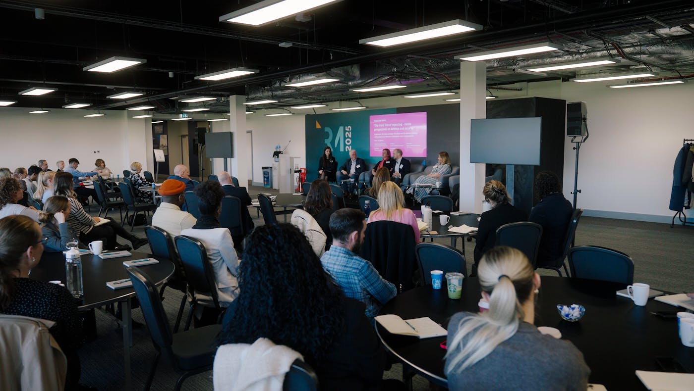 Room full of people at the conference