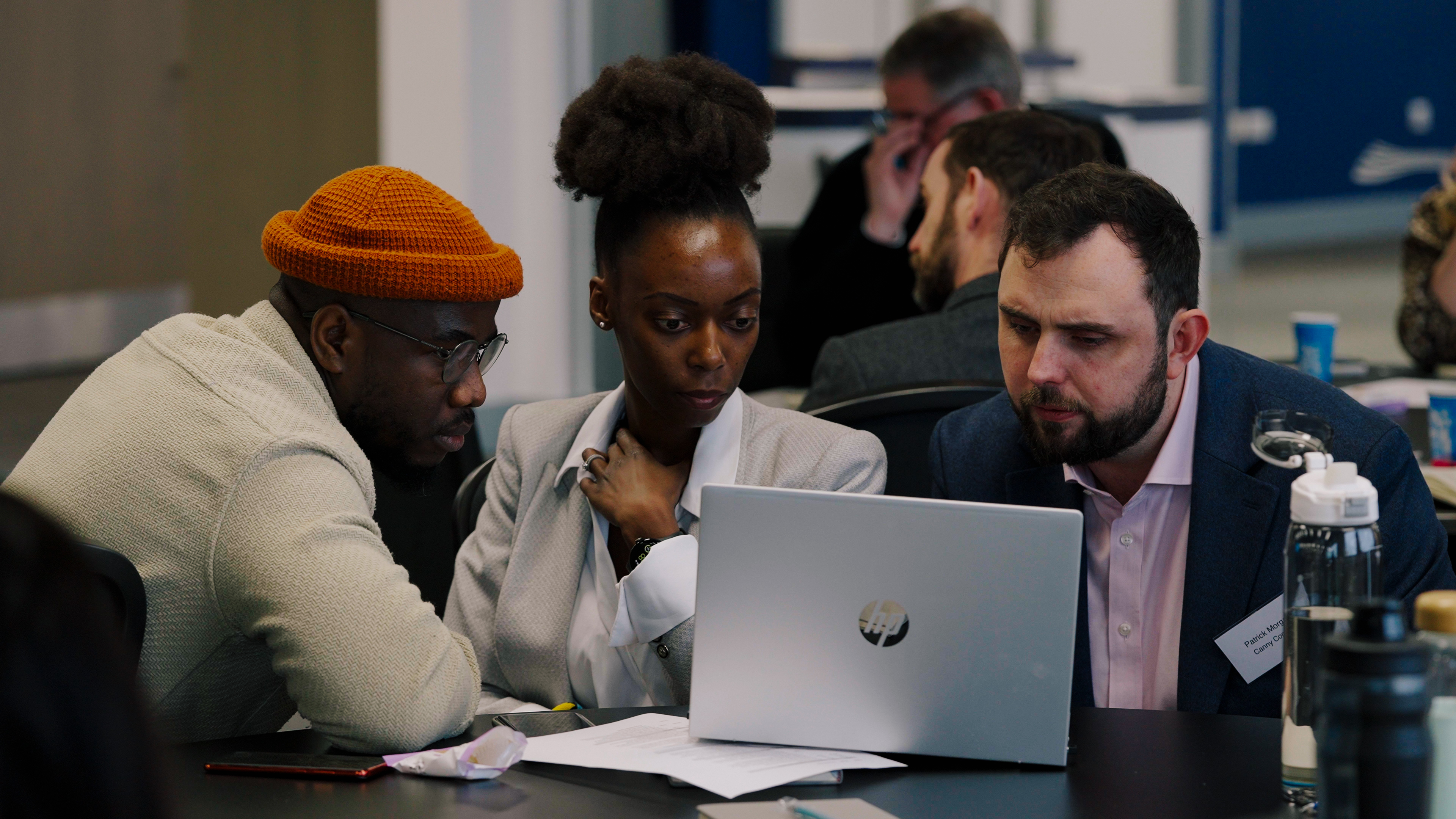 Picture of people collaborating and sharing ideas