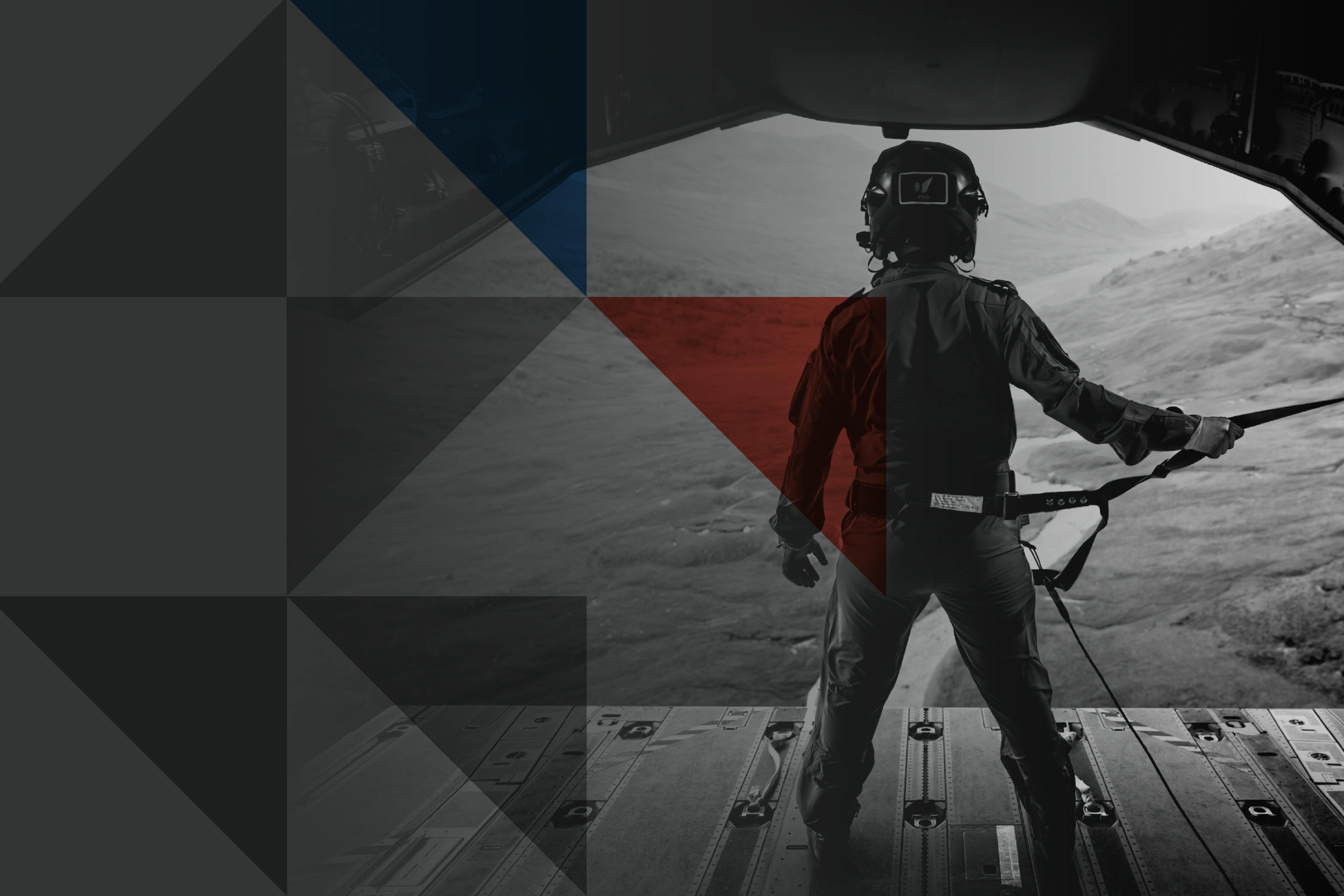 Background banner image showing RAF load master standing on an aircraft ramp looking out to the Welsh Hills.