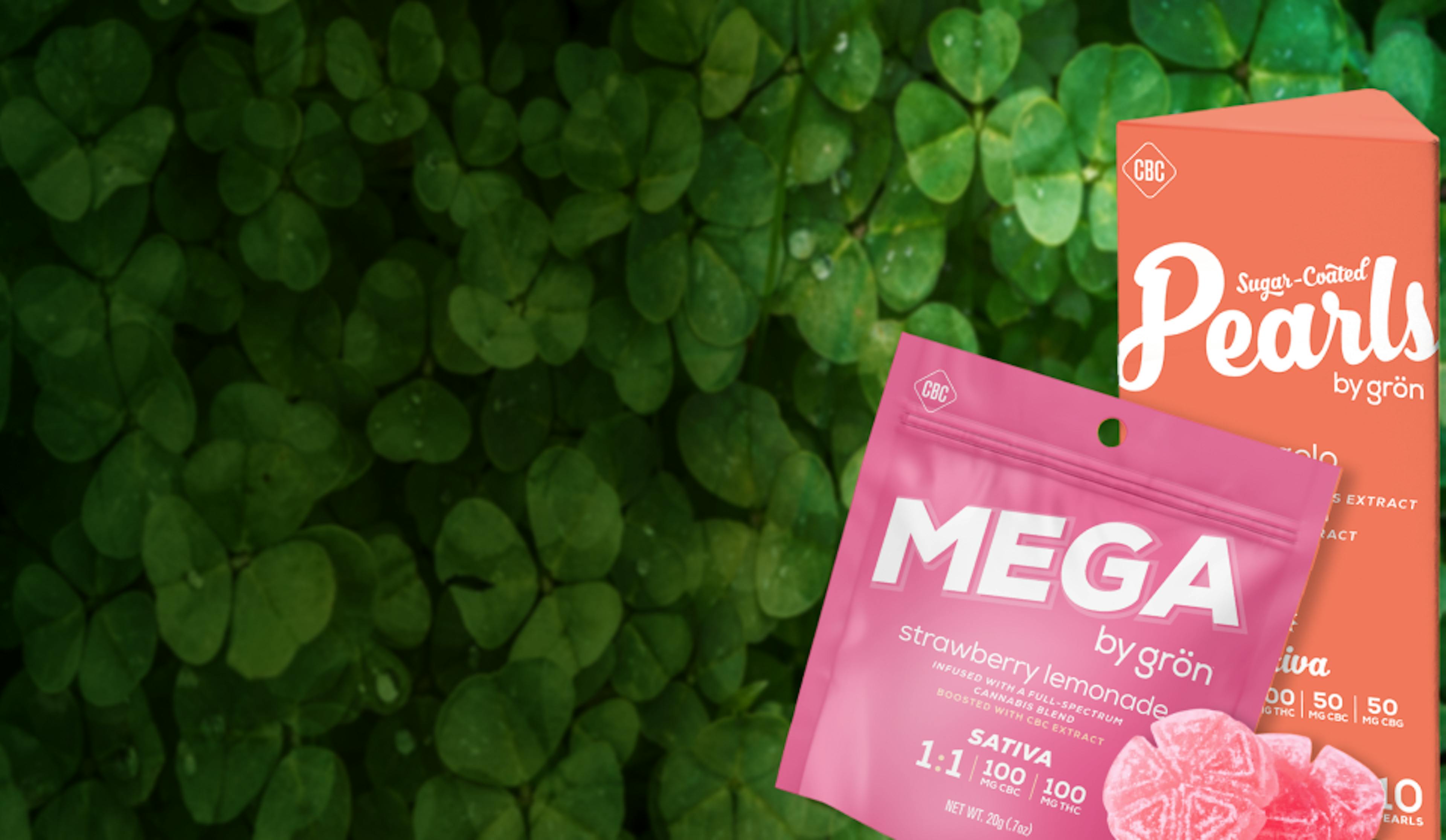 An image of Gron products, one pink packet saying Mega and one orange saying Pearls, surrounded by pink gummies. Products are against a green background showing clover leaves.