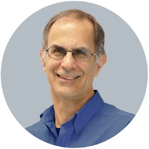Headshot of Don Parisi wearing glasses and a blue shirt