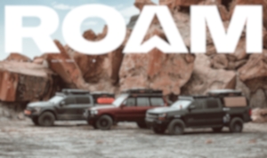 Roam gear showcased by three vehicles against a backdrop of red rocks, perfect for off-road adventures.