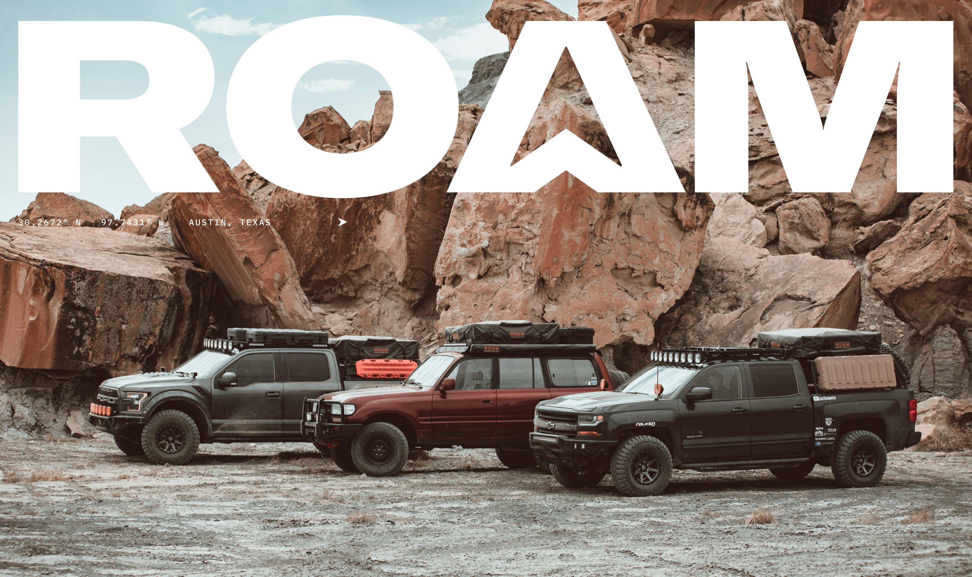 Roam gear showcased by three vehicles against a backdrop of red rocks, perfect for off-road adventures.