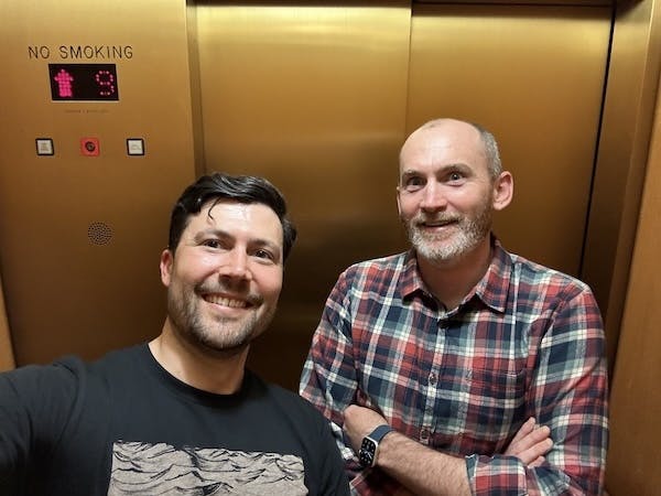 Going up! Andrew and Adam in the figurative and literal elevator together.