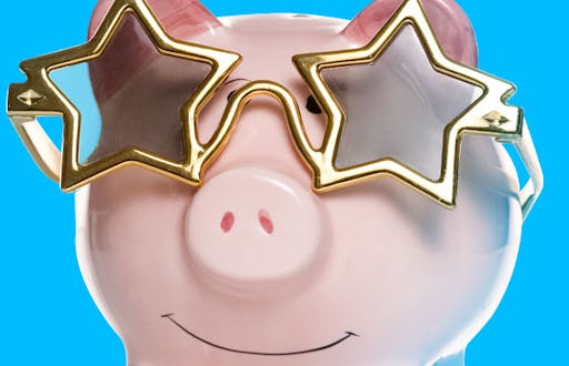 Piggy bank wearing star shaped sunglasses.