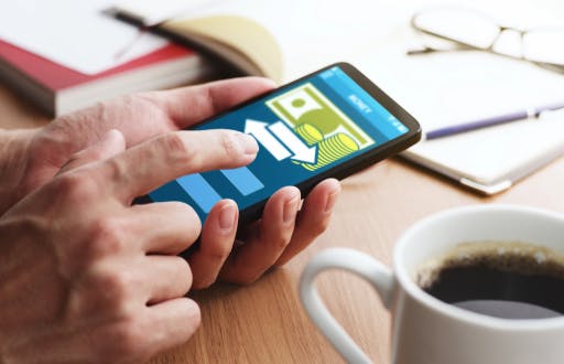Person transferring money on their smart phone.
