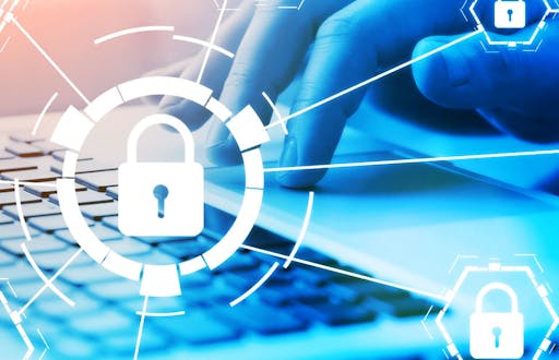 Hand typing on a laptop keyboard with padlocks overlaid above it.
