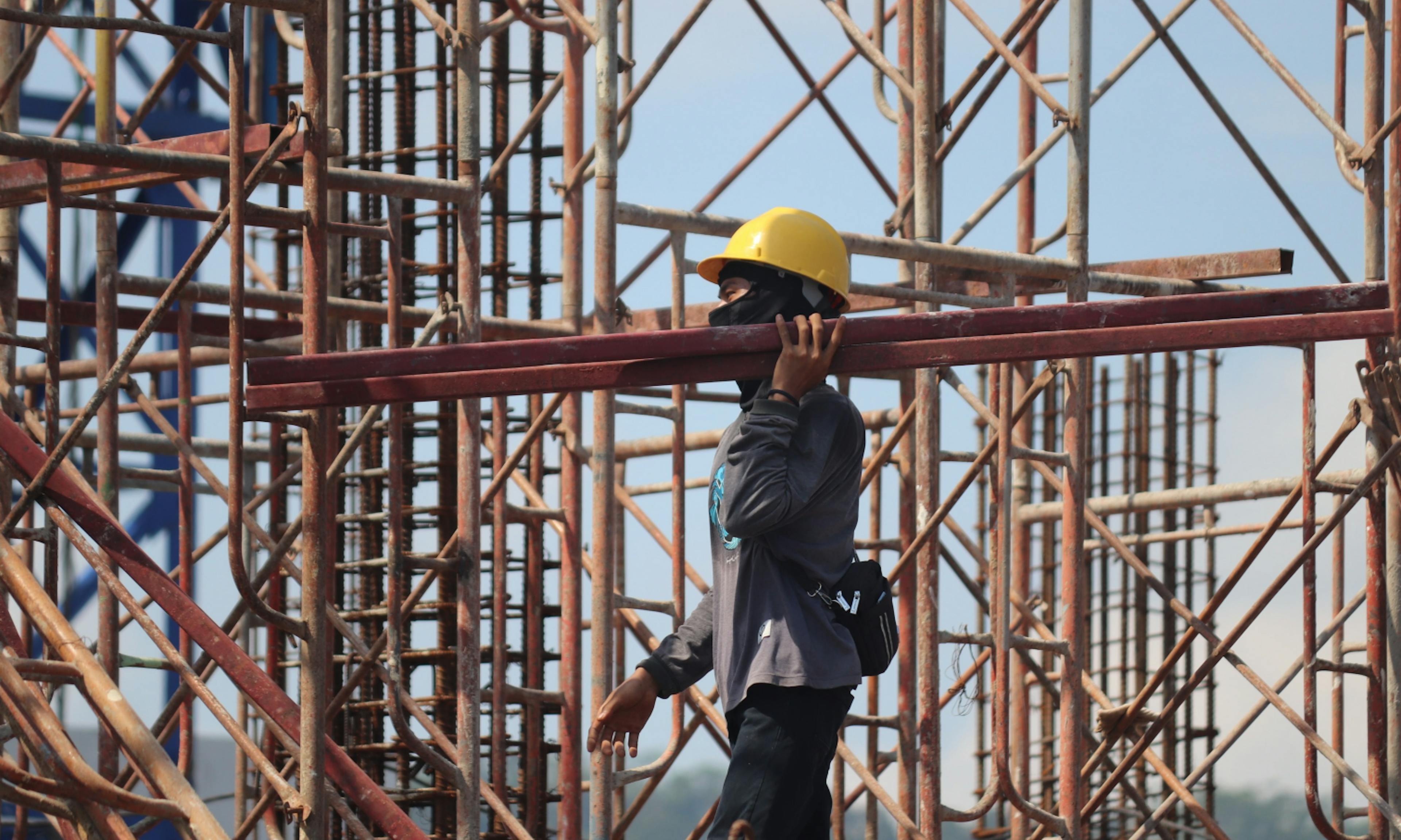 engineer carrying metal