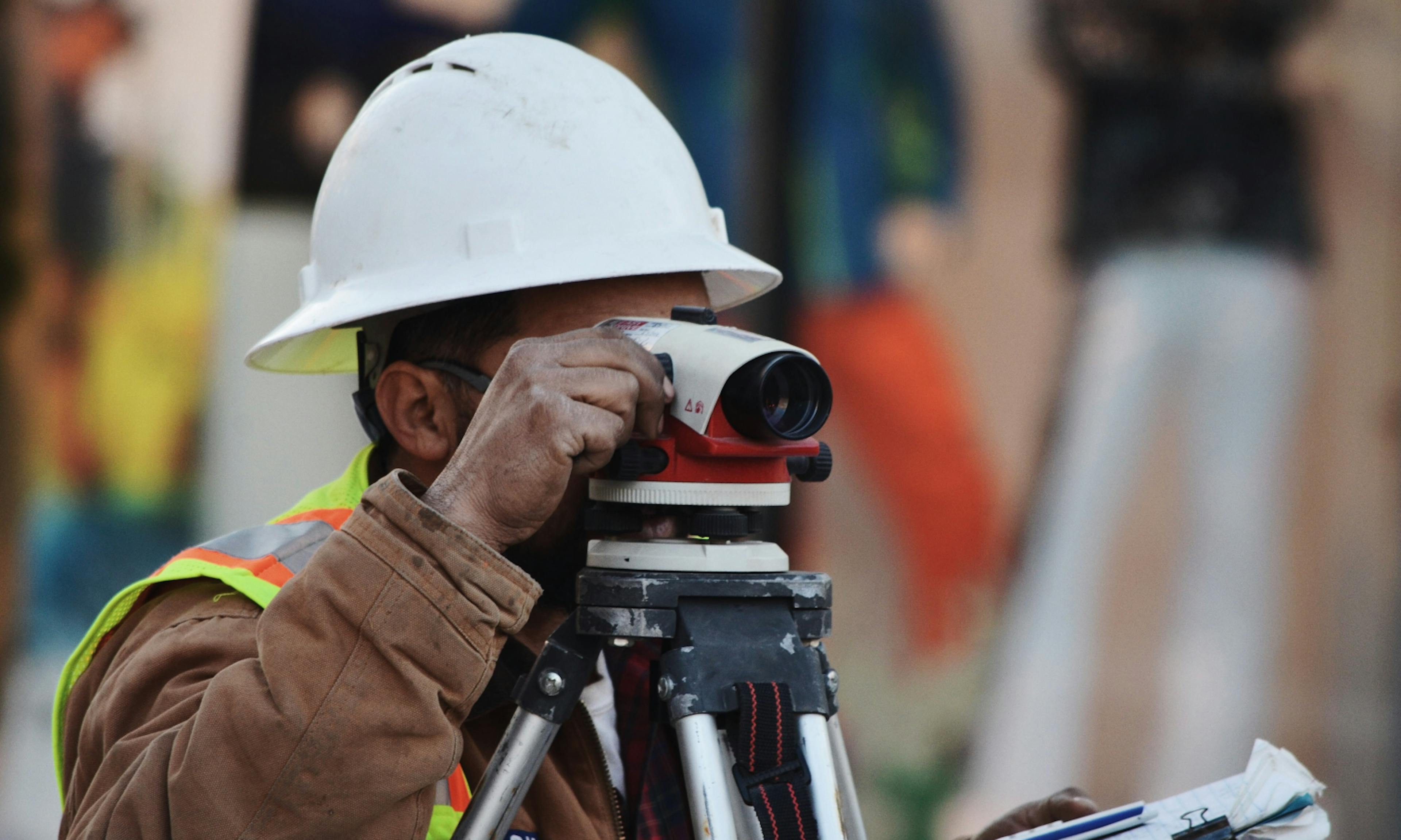 engineer looking through equipment