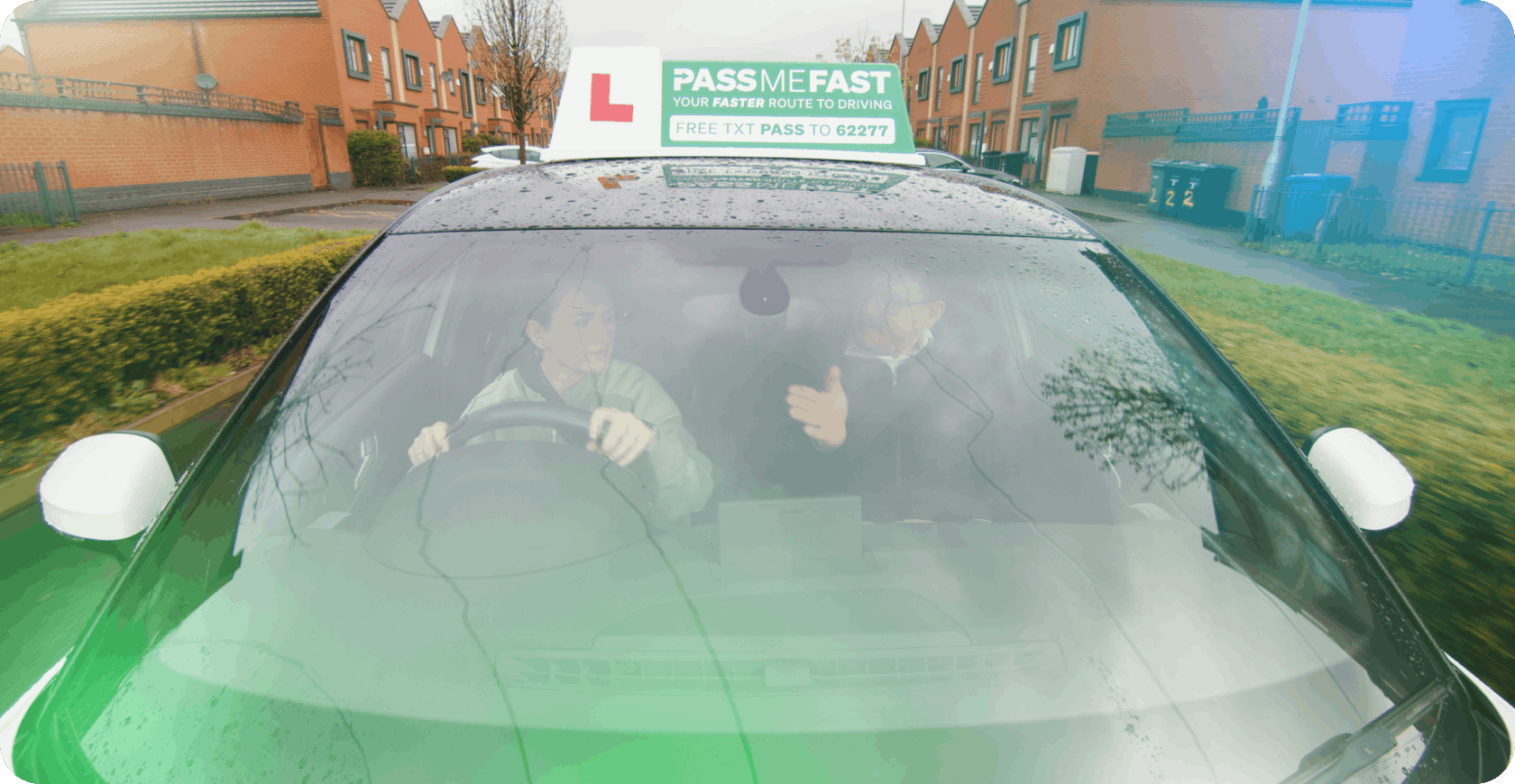 Woman and instructor driving a PassMeFast car
