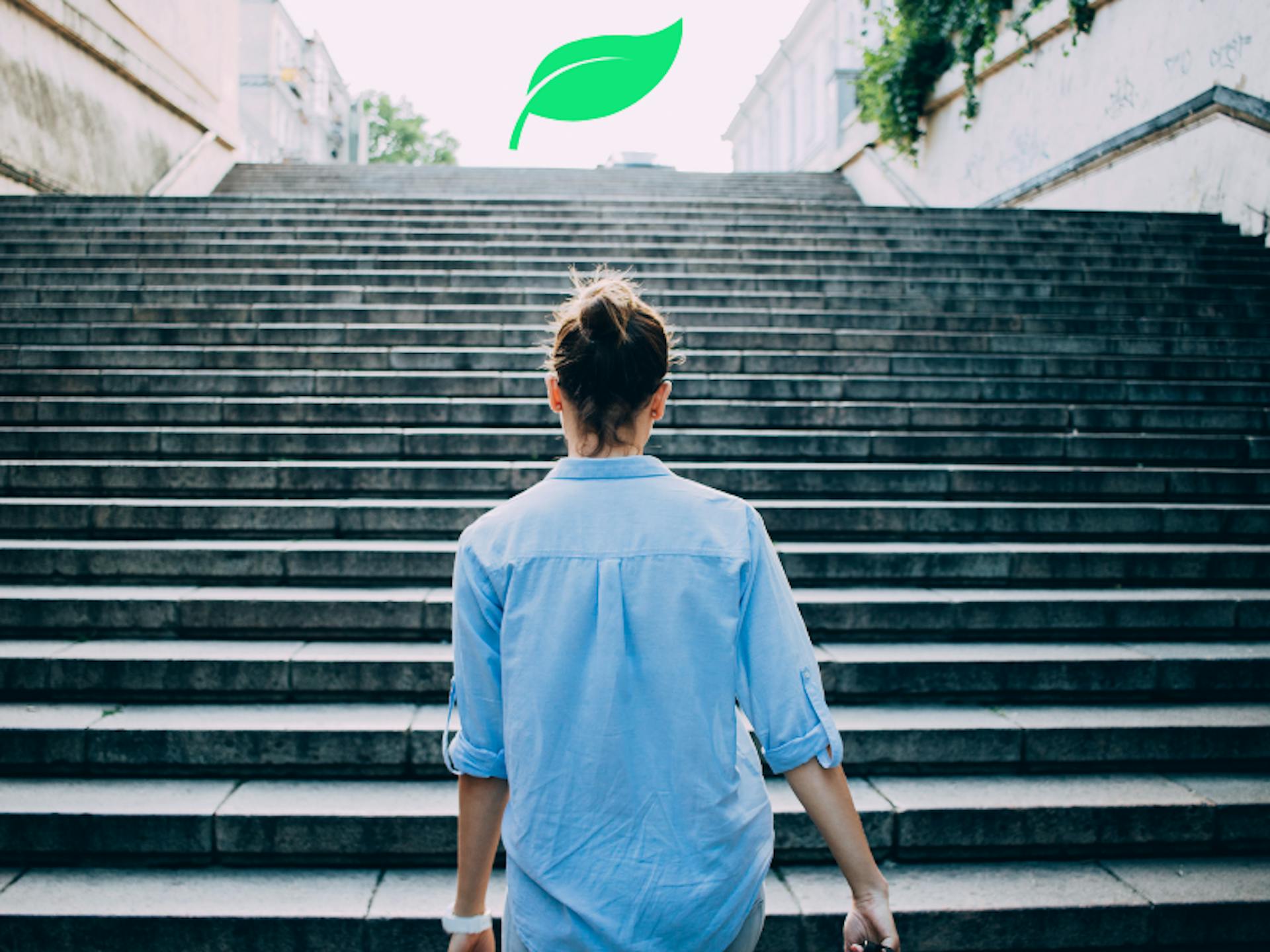 Business person walking up stairs on a sustainability journey 