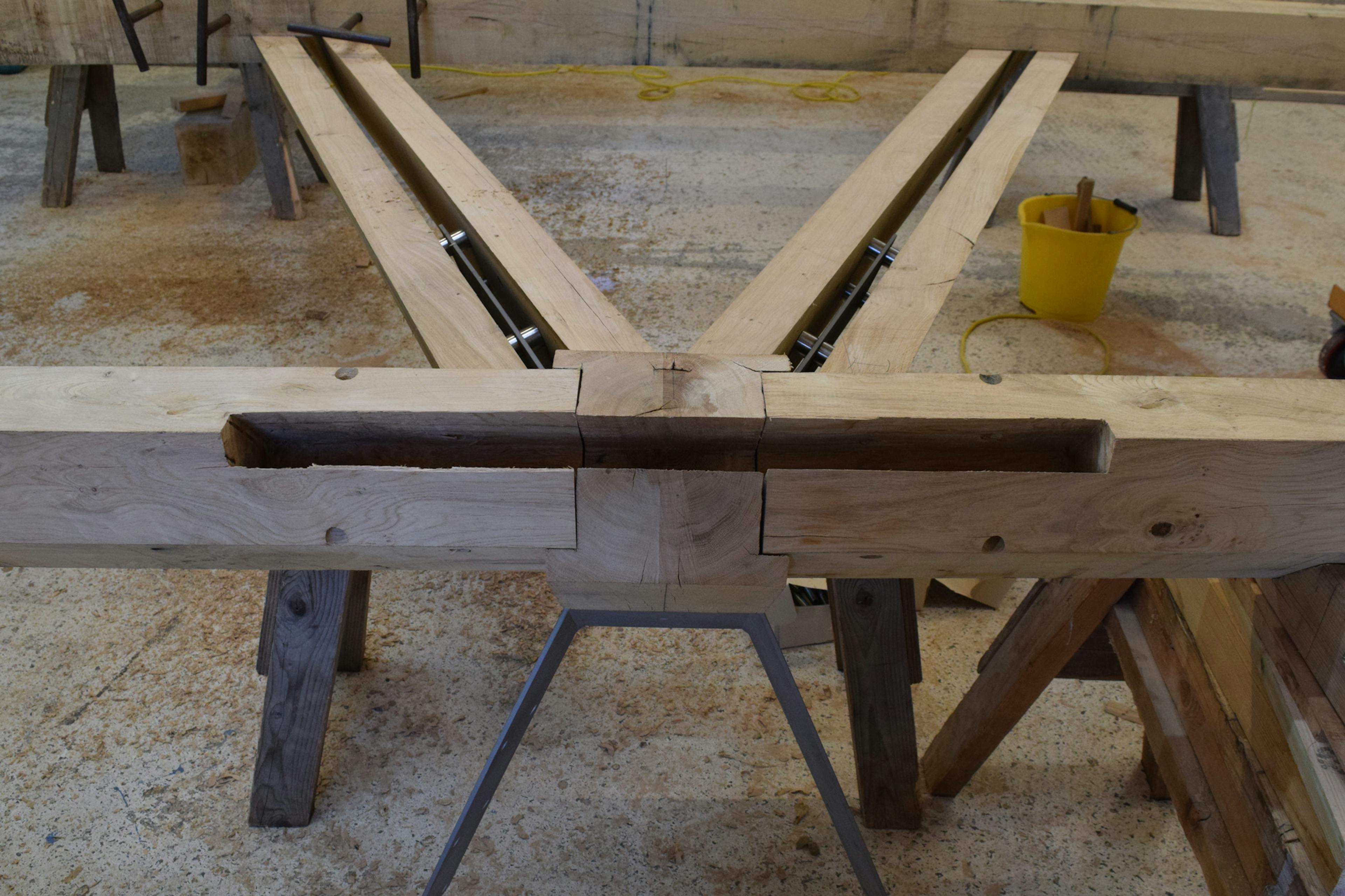 An oak frame with steel connections in a carpenters workshop