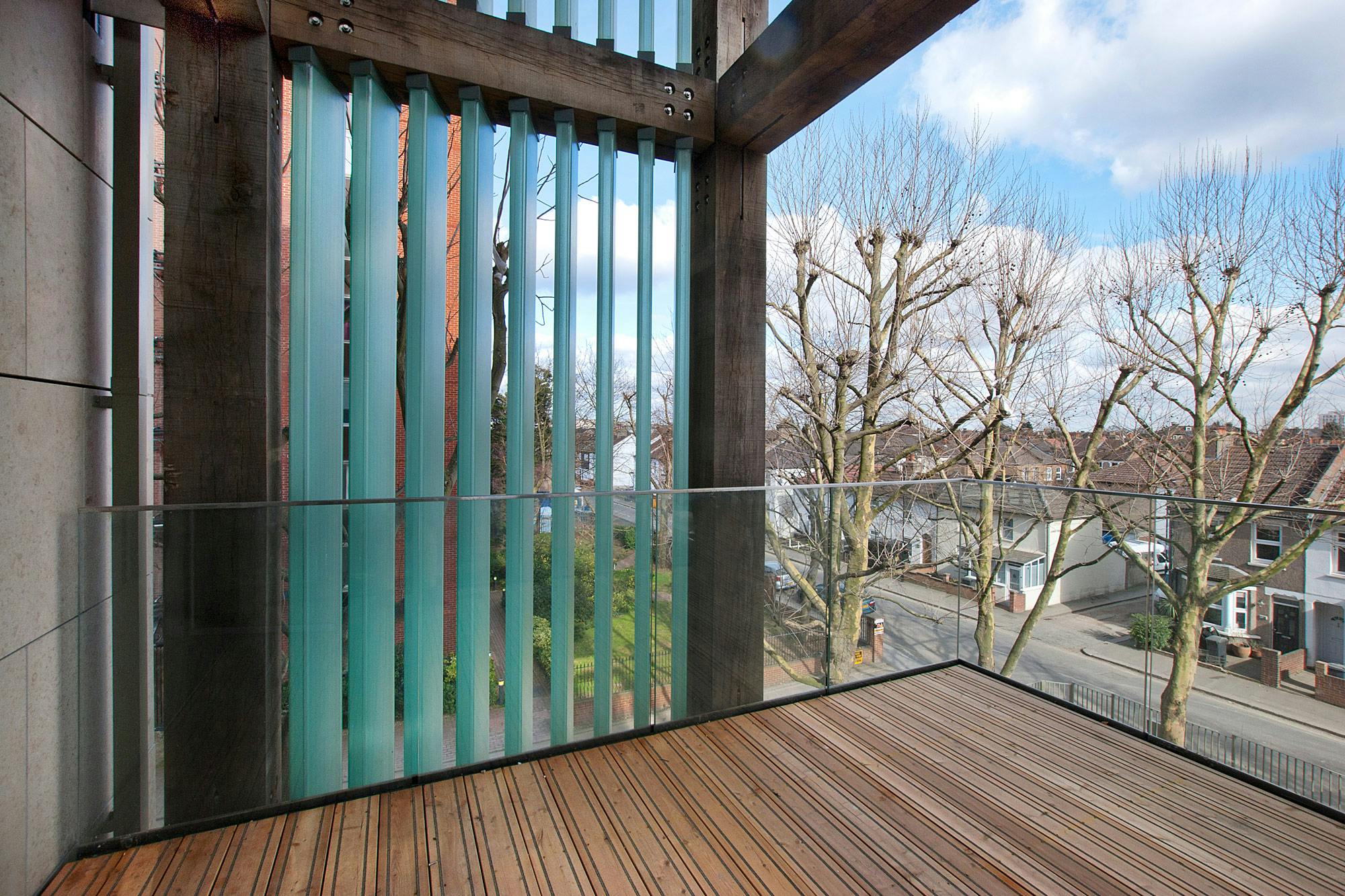A green oak balcony on a high rise building
