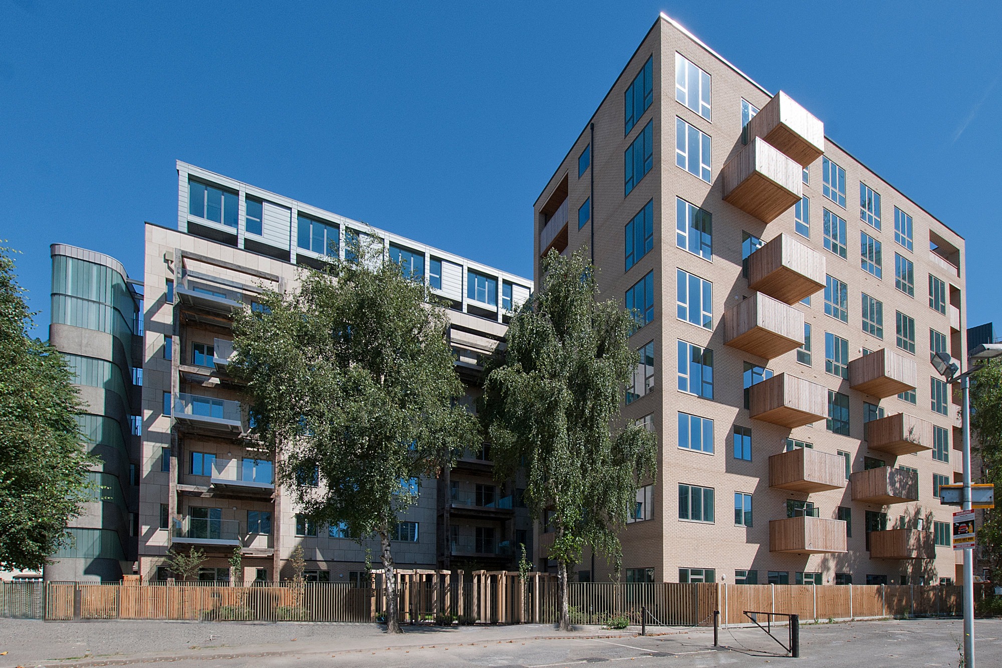 Green oak balconies on a high rise building