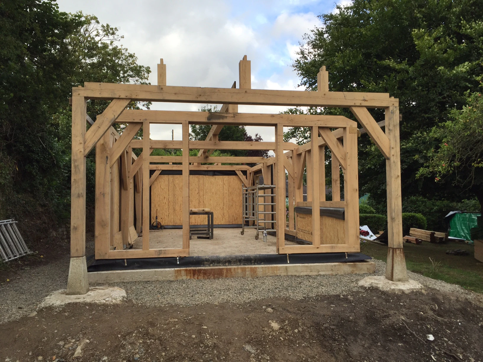 An oak framed cabin being installed