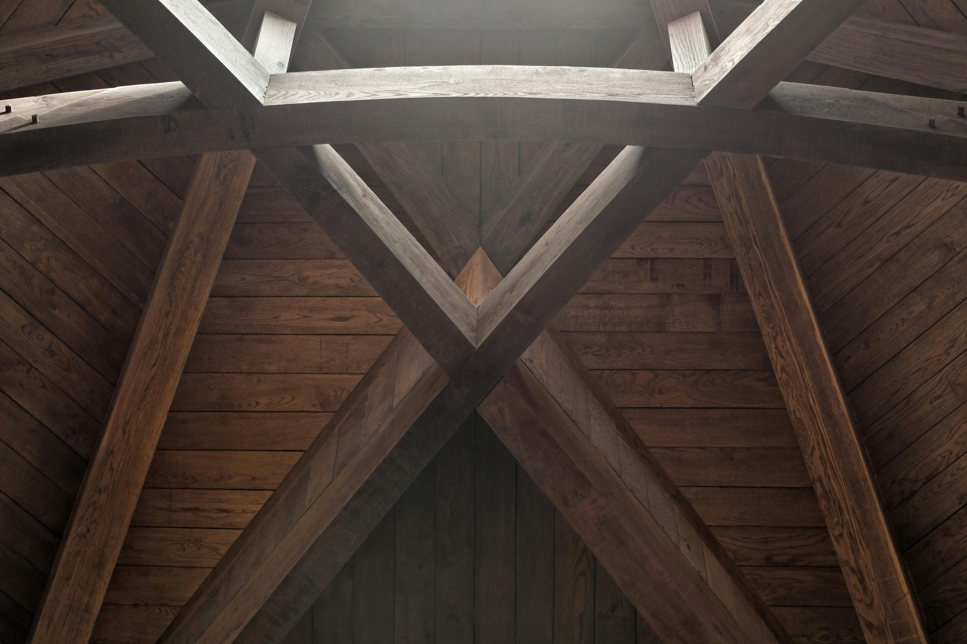 The detail on an octagonal oak roof structure