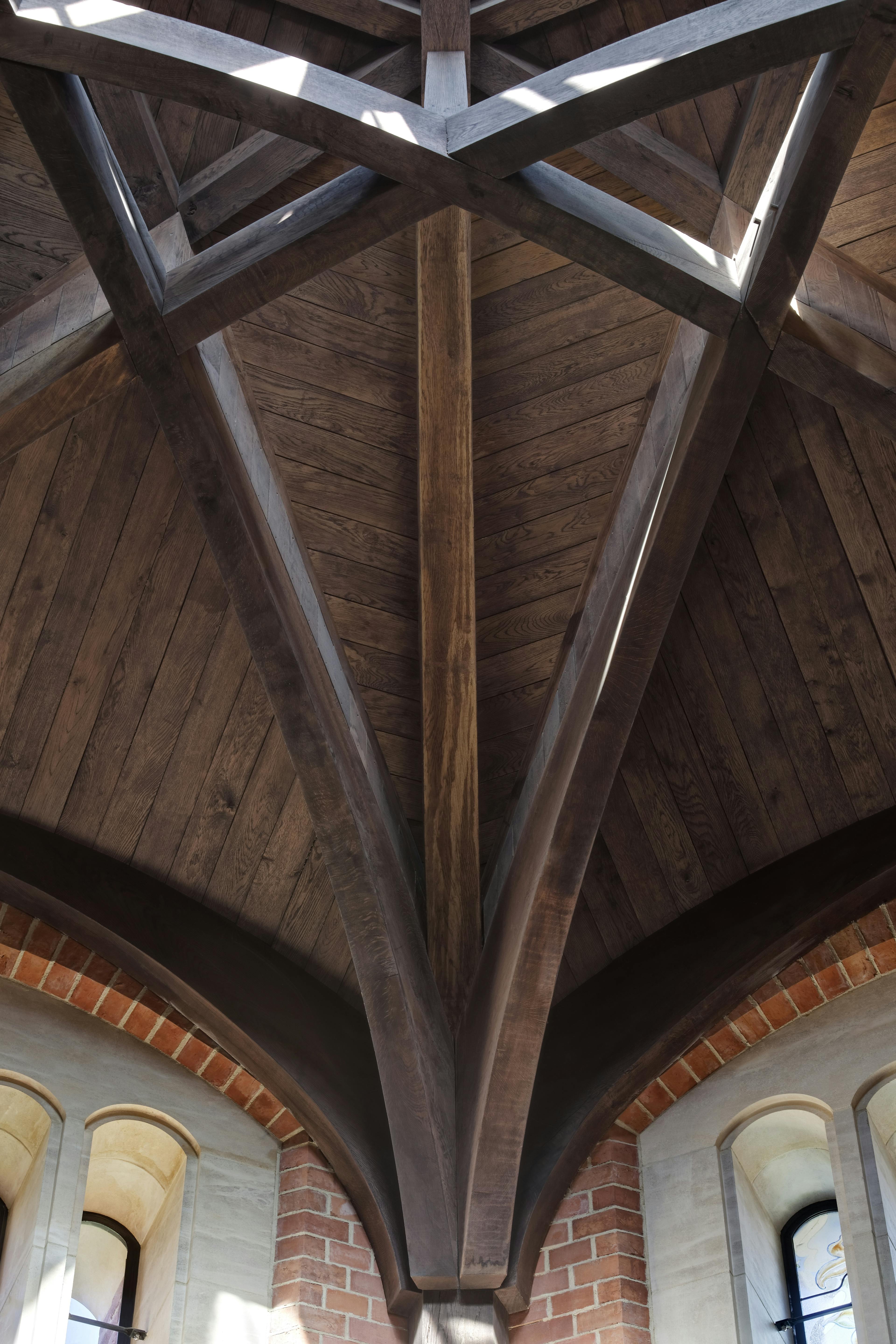 The detail on an octagonal oak roof structure