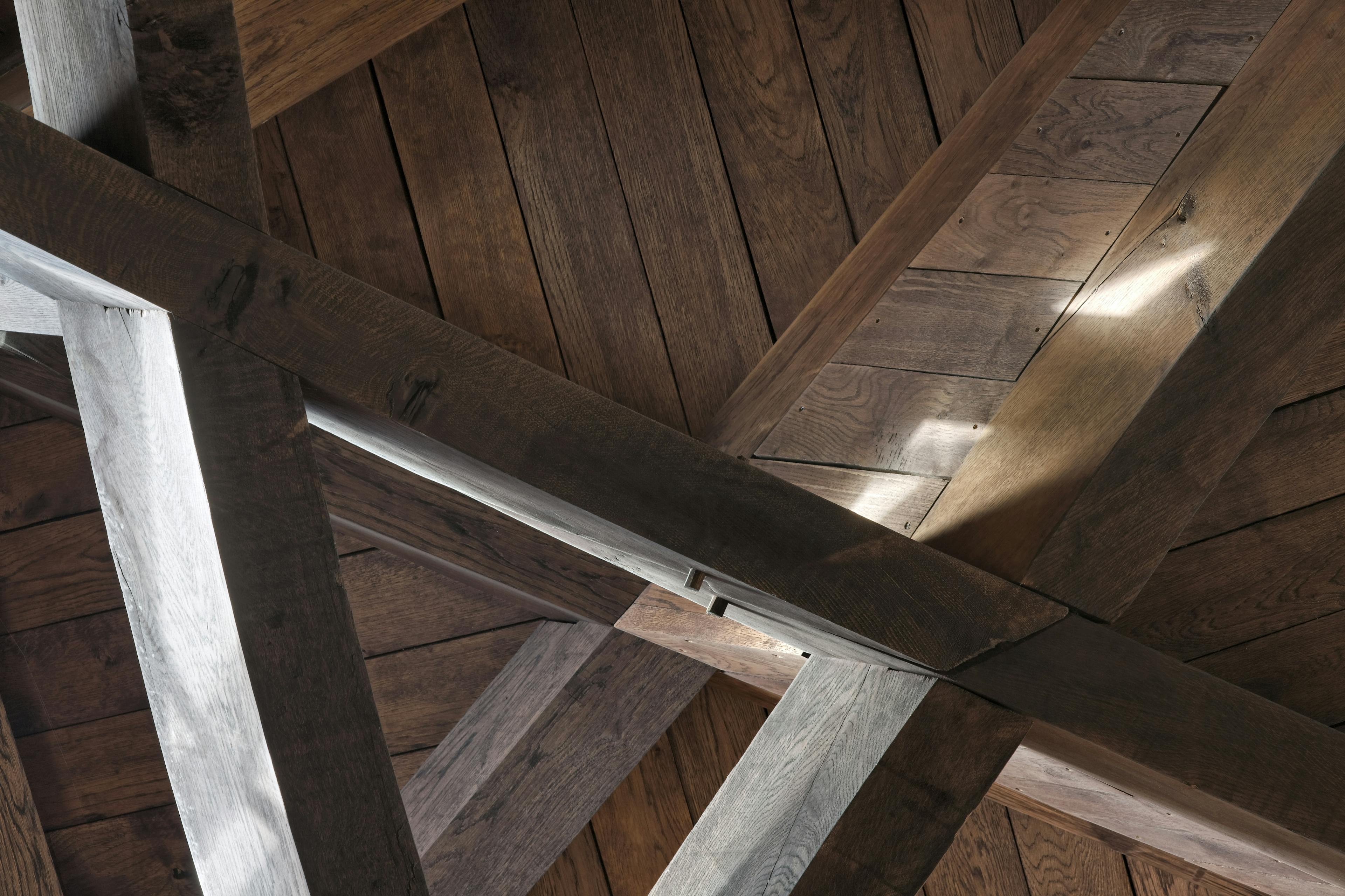 The detail on an octagonal oak roof structure