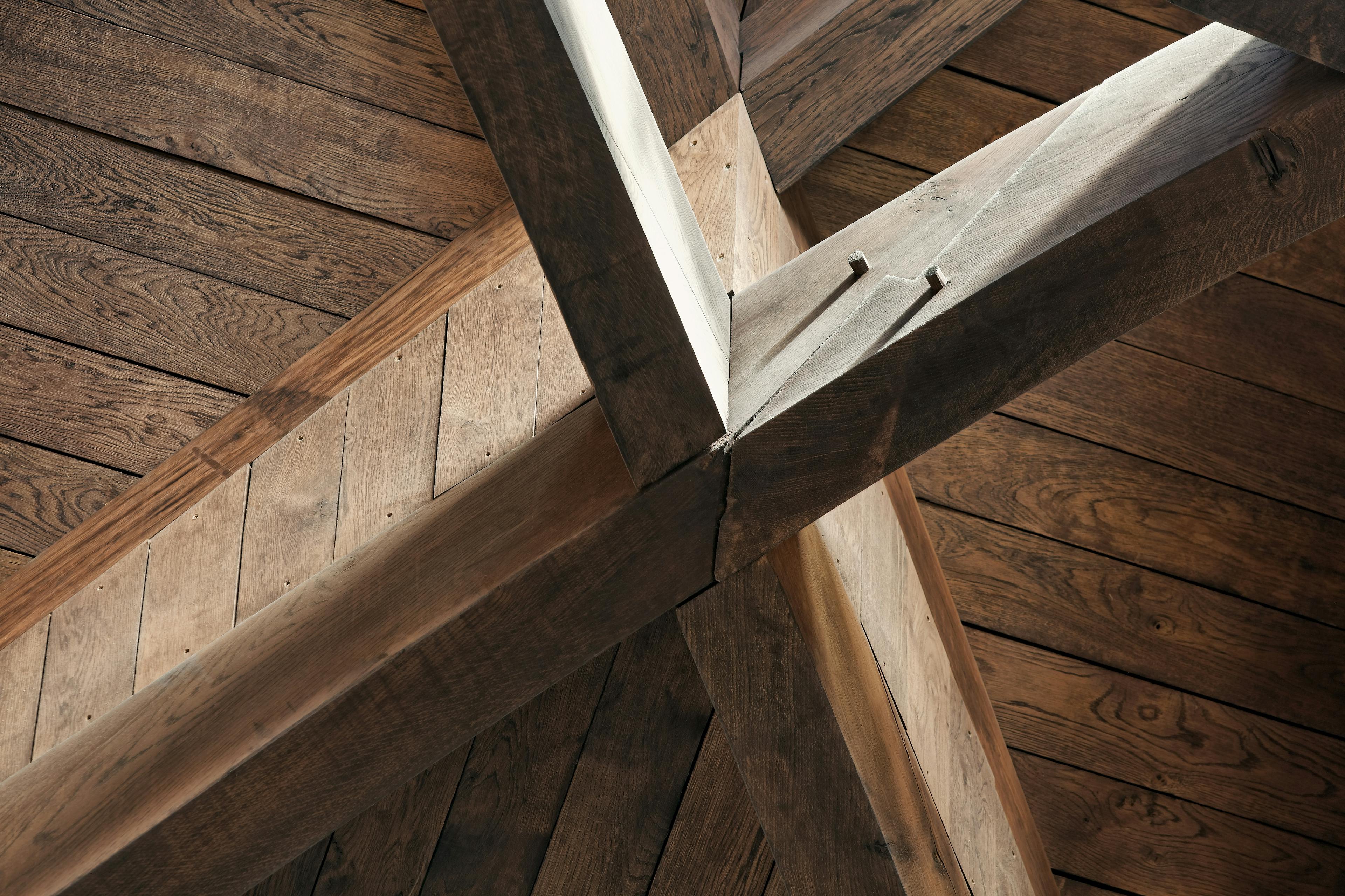 The detail on an octagonal oak roof structure