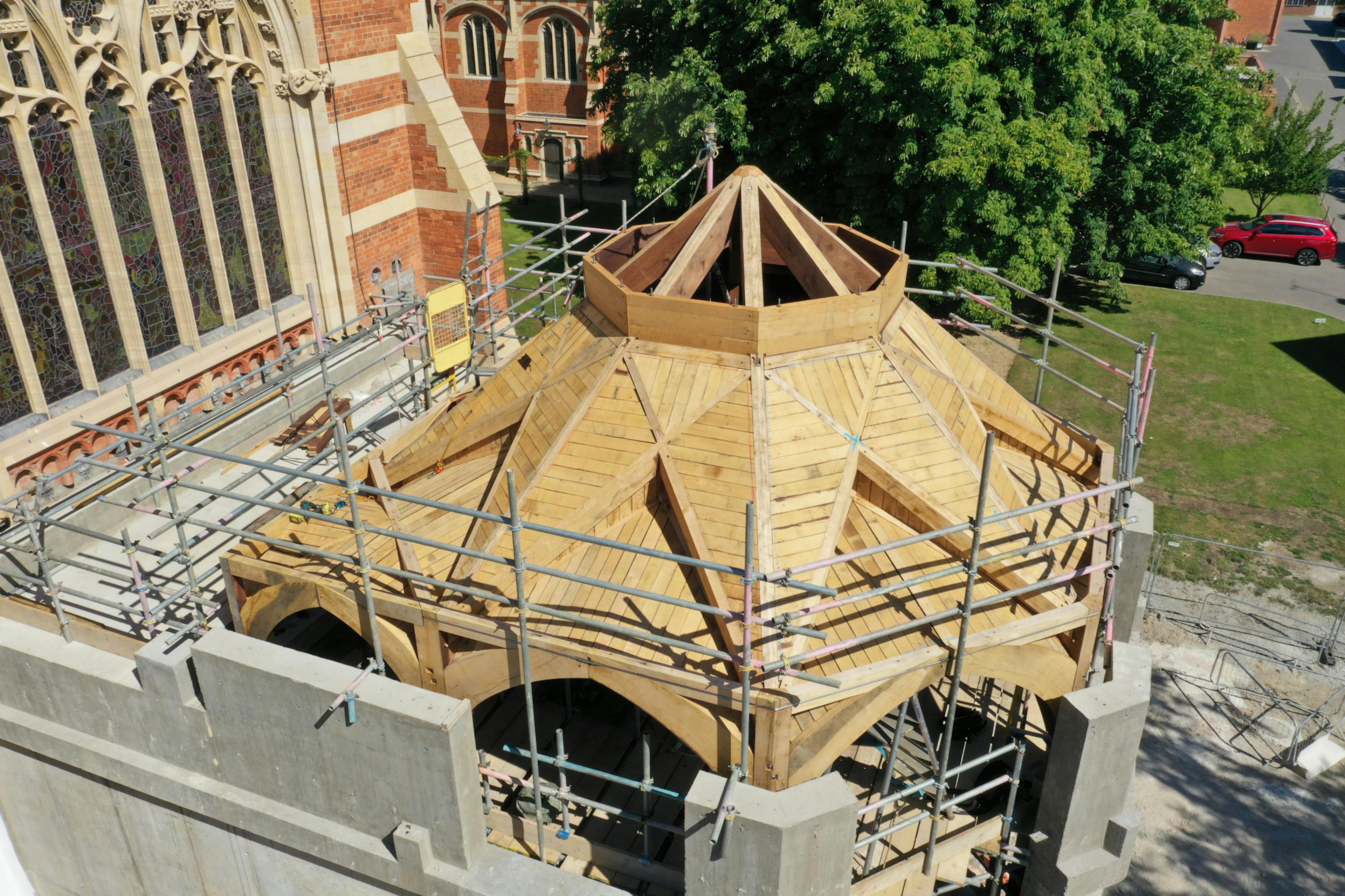 An extension to a 19th century chapel with an octagonal oak framed roof structure during construction