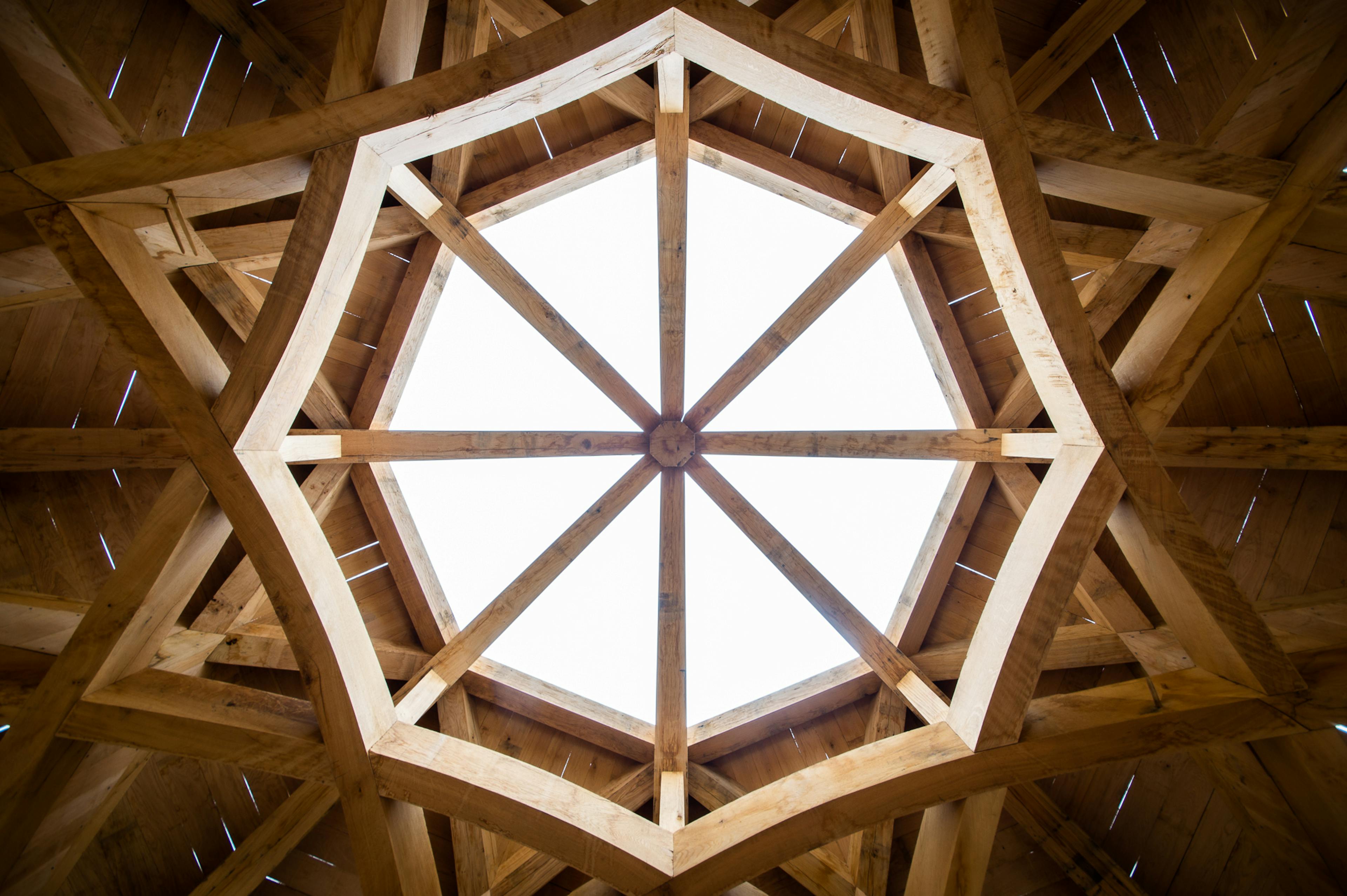 A complex octagonal oak roof structure