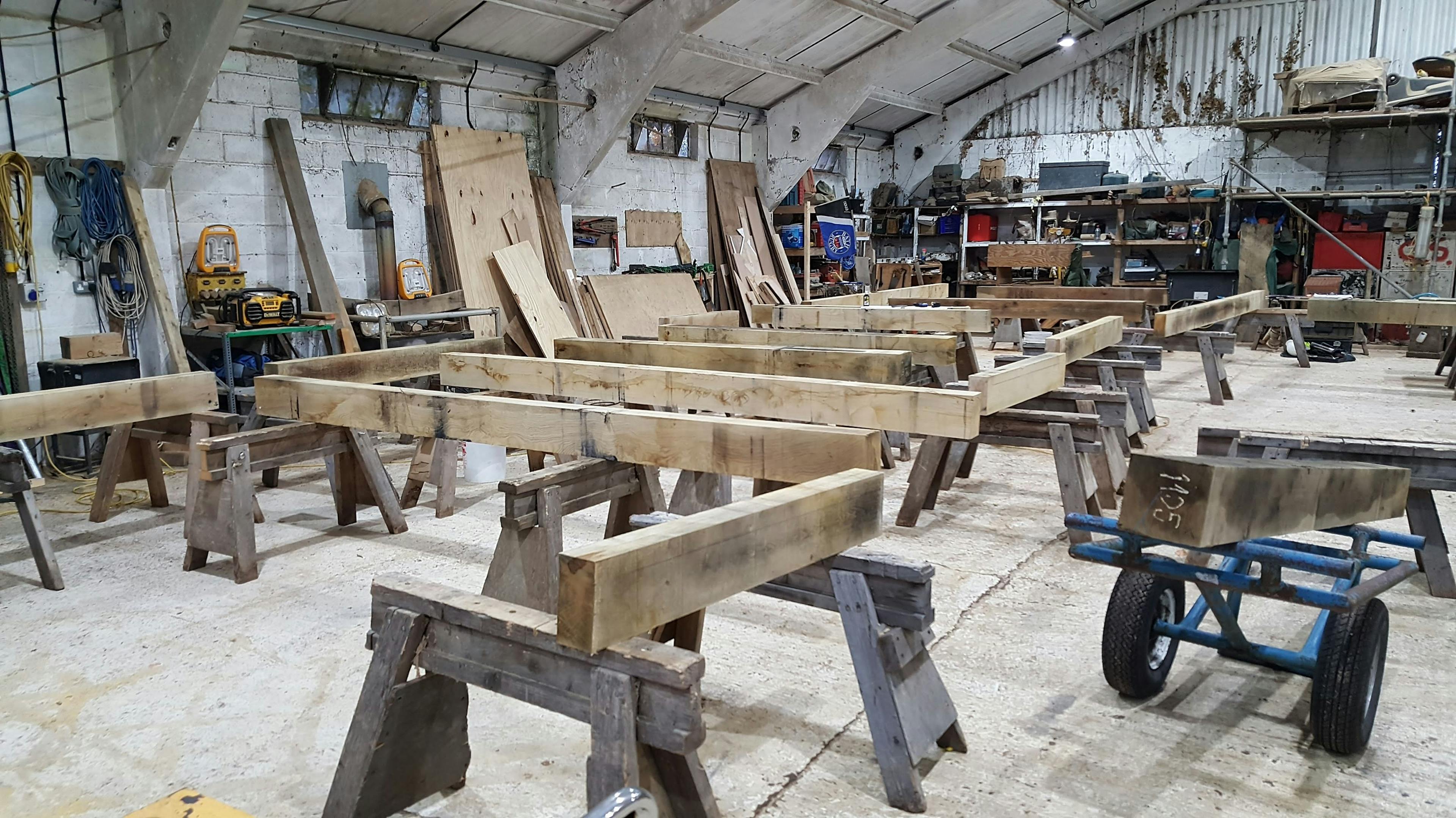An oak framed wedding barn during manufacturing in a workshop