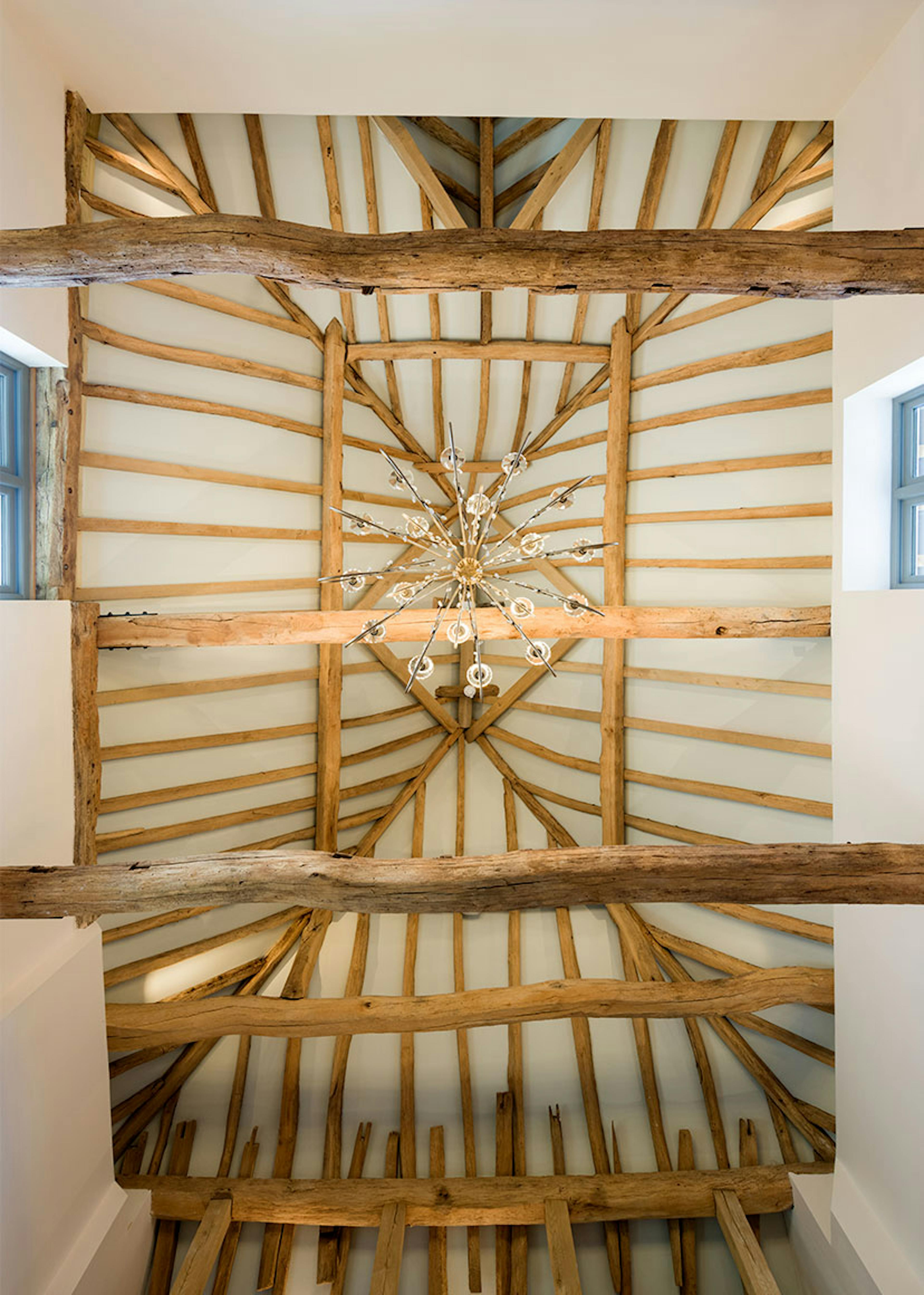 The ceiling of an oak framed wedding barn hall