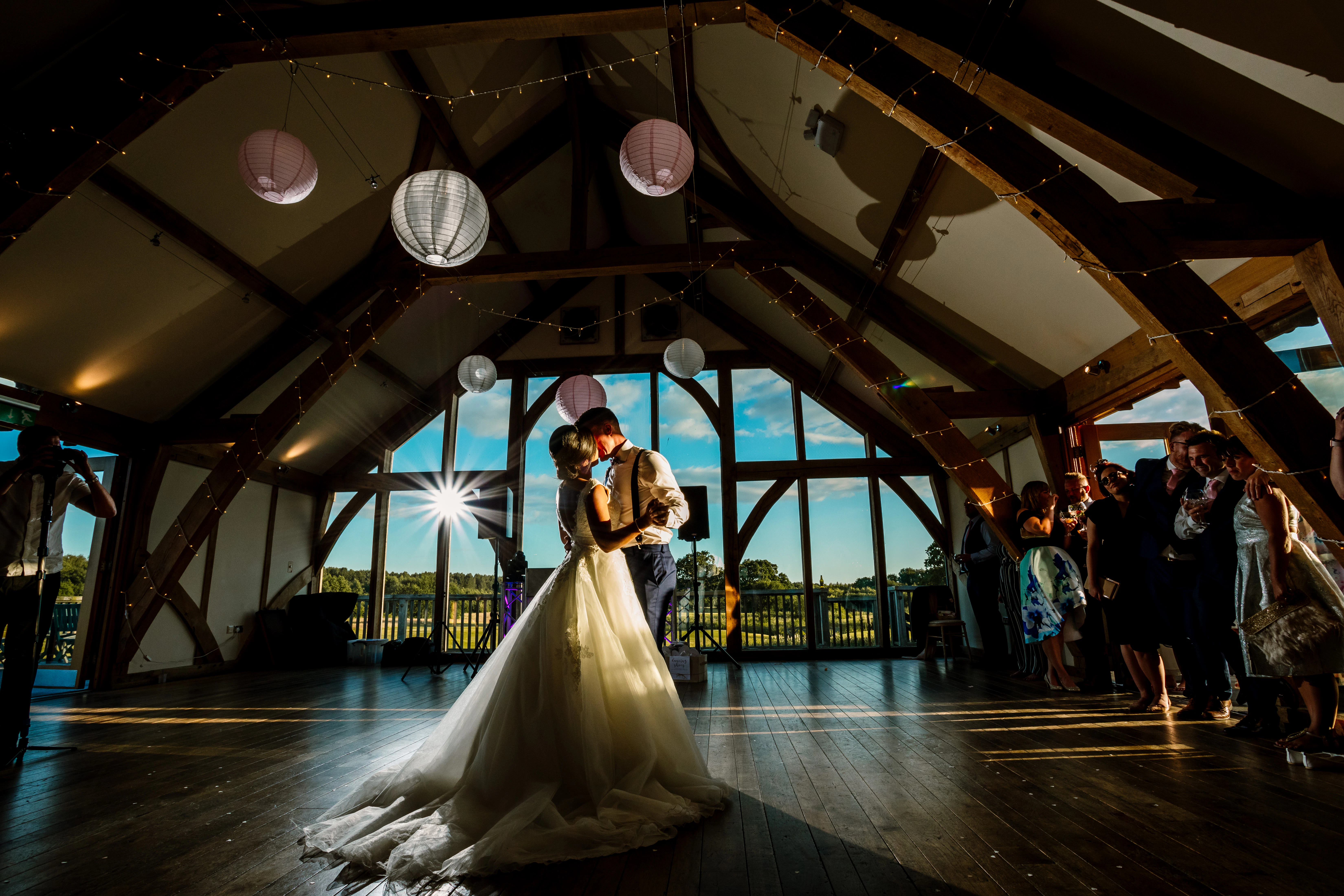 A bride and groom dancing in an oak 