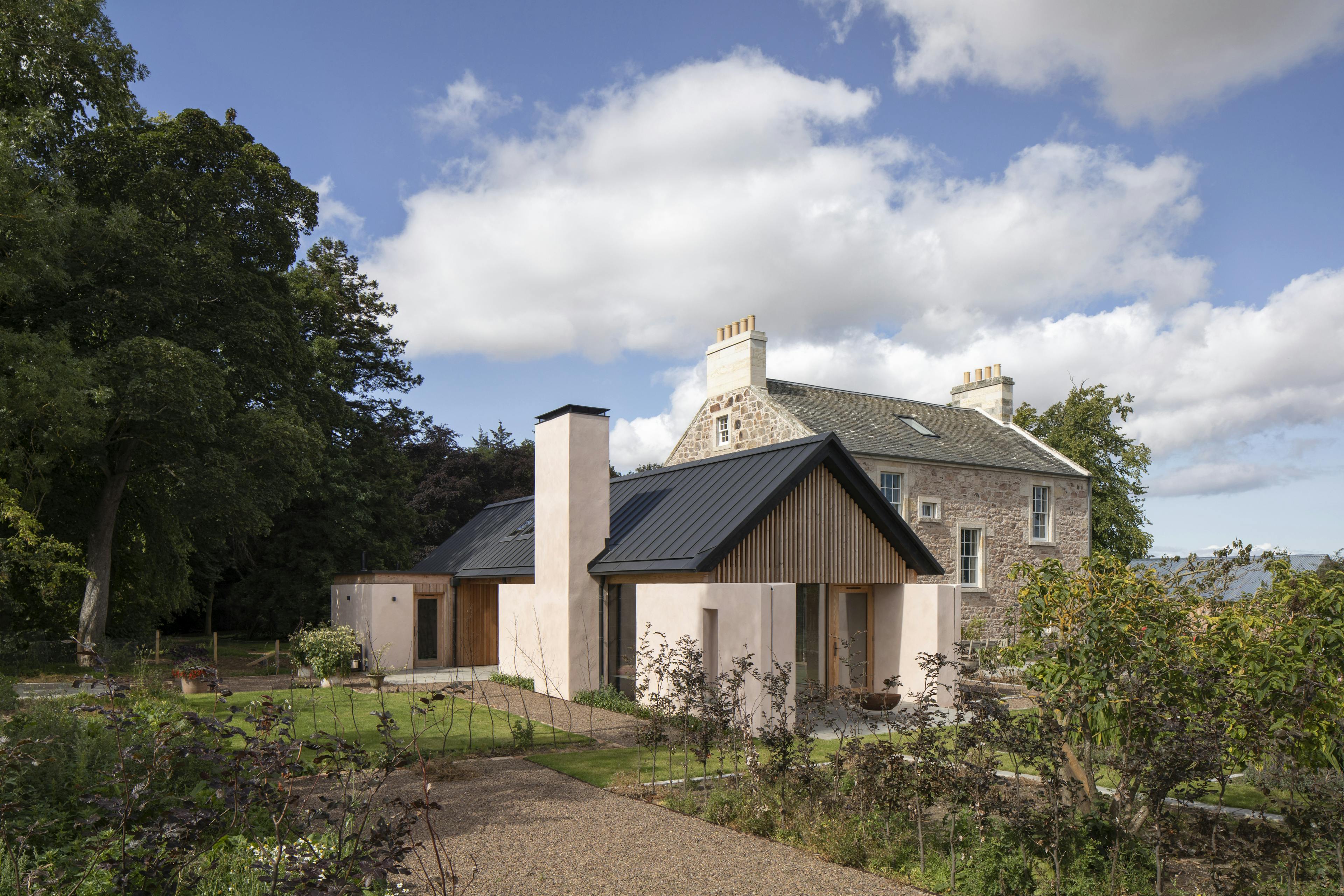 Douglas fir framed extension to a Georgian country manor house set in landscaped gardens