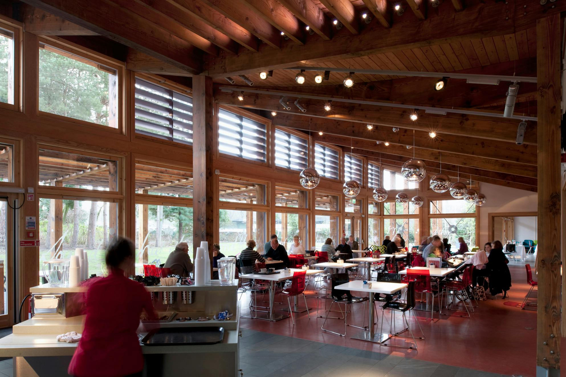 People in a Douglas fir framed cafe