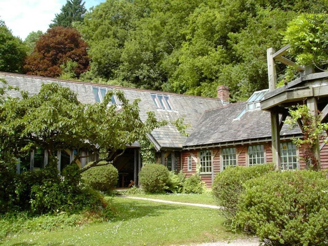 A timber clad oak framed home set in a pretty garden