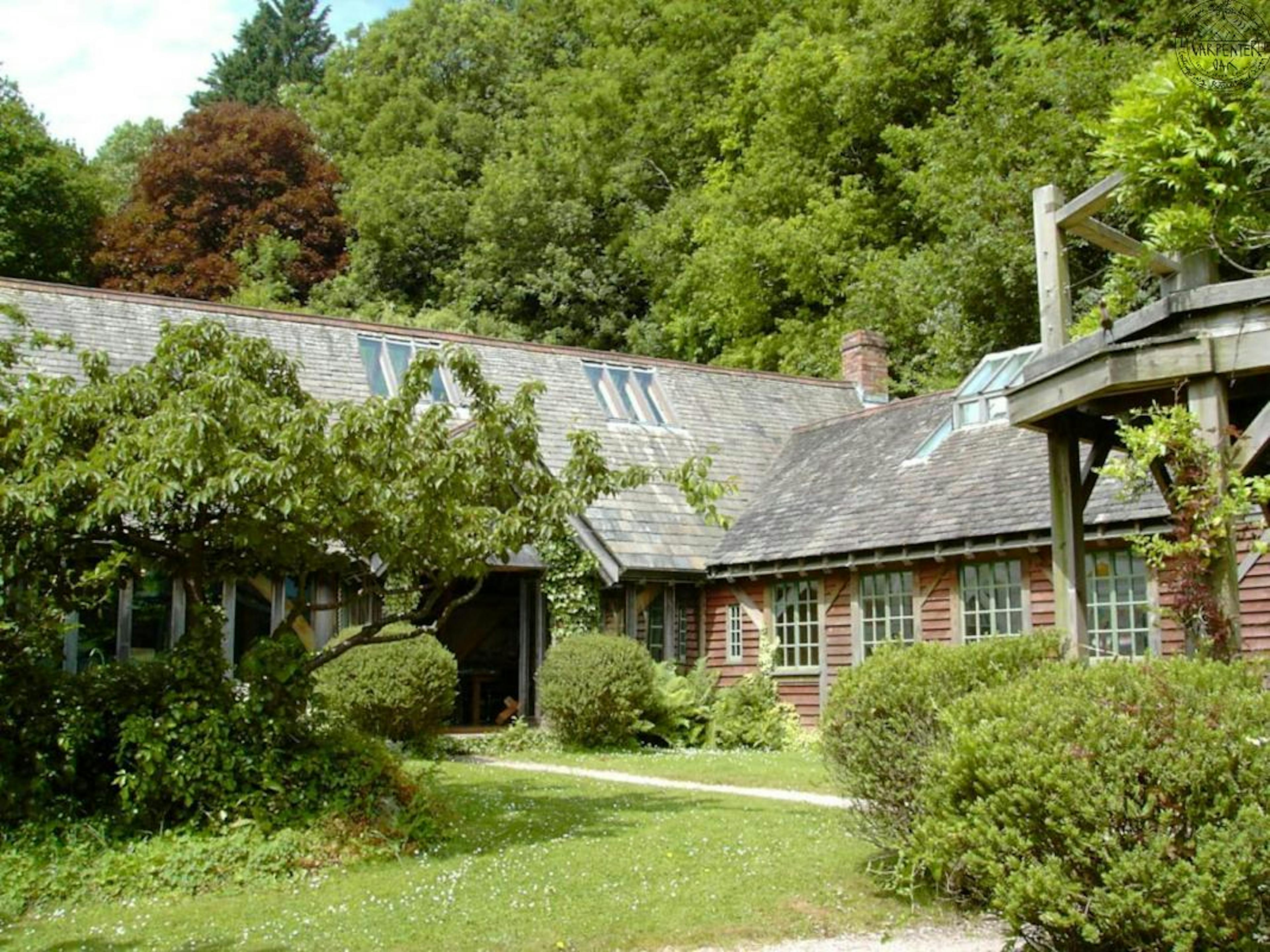 A timber clad oak framed home set in a pretty garden
