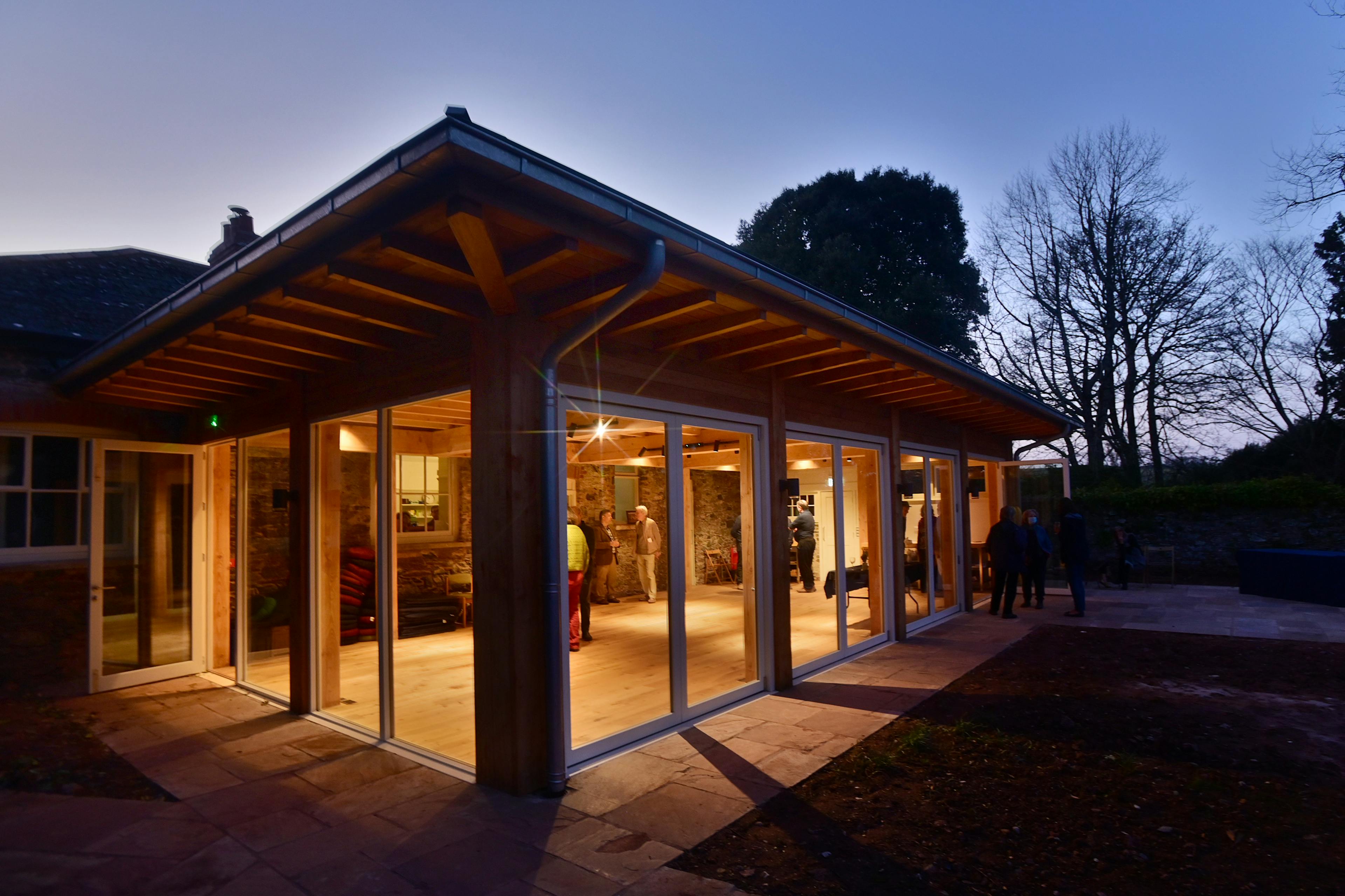At dusk the light shines from a Douglas fir framed meditation room 