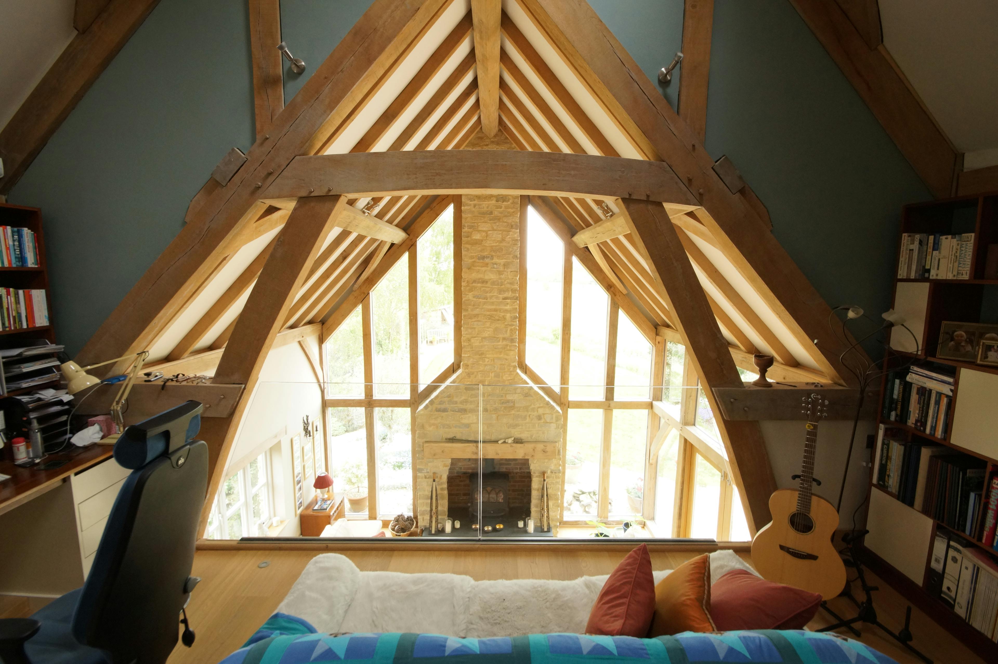An oak framed mezzanine area with study and music studio