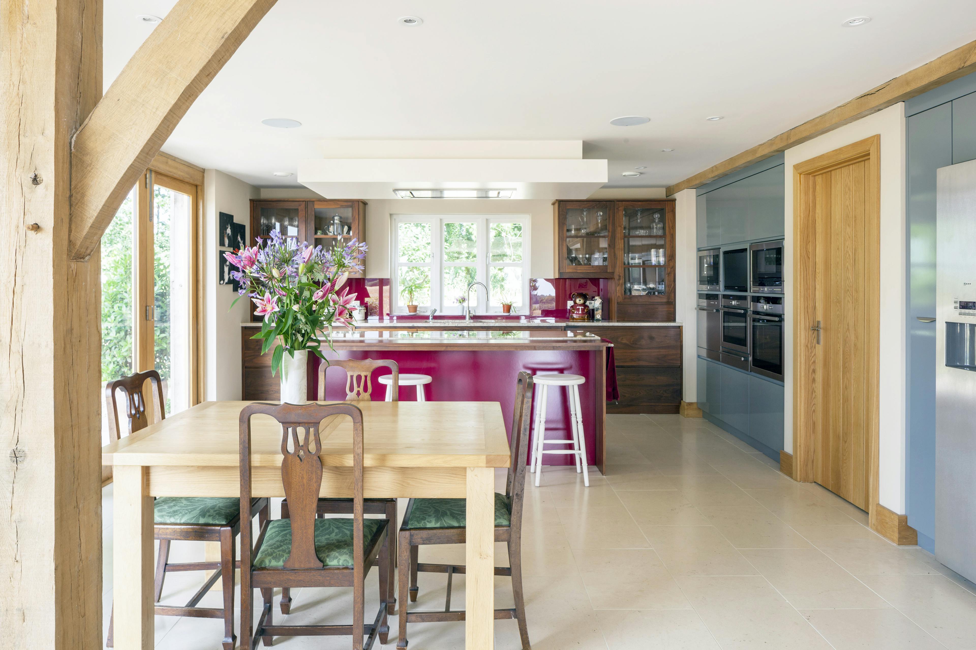 An oak framed kitchen dining room with island and breakfast bar