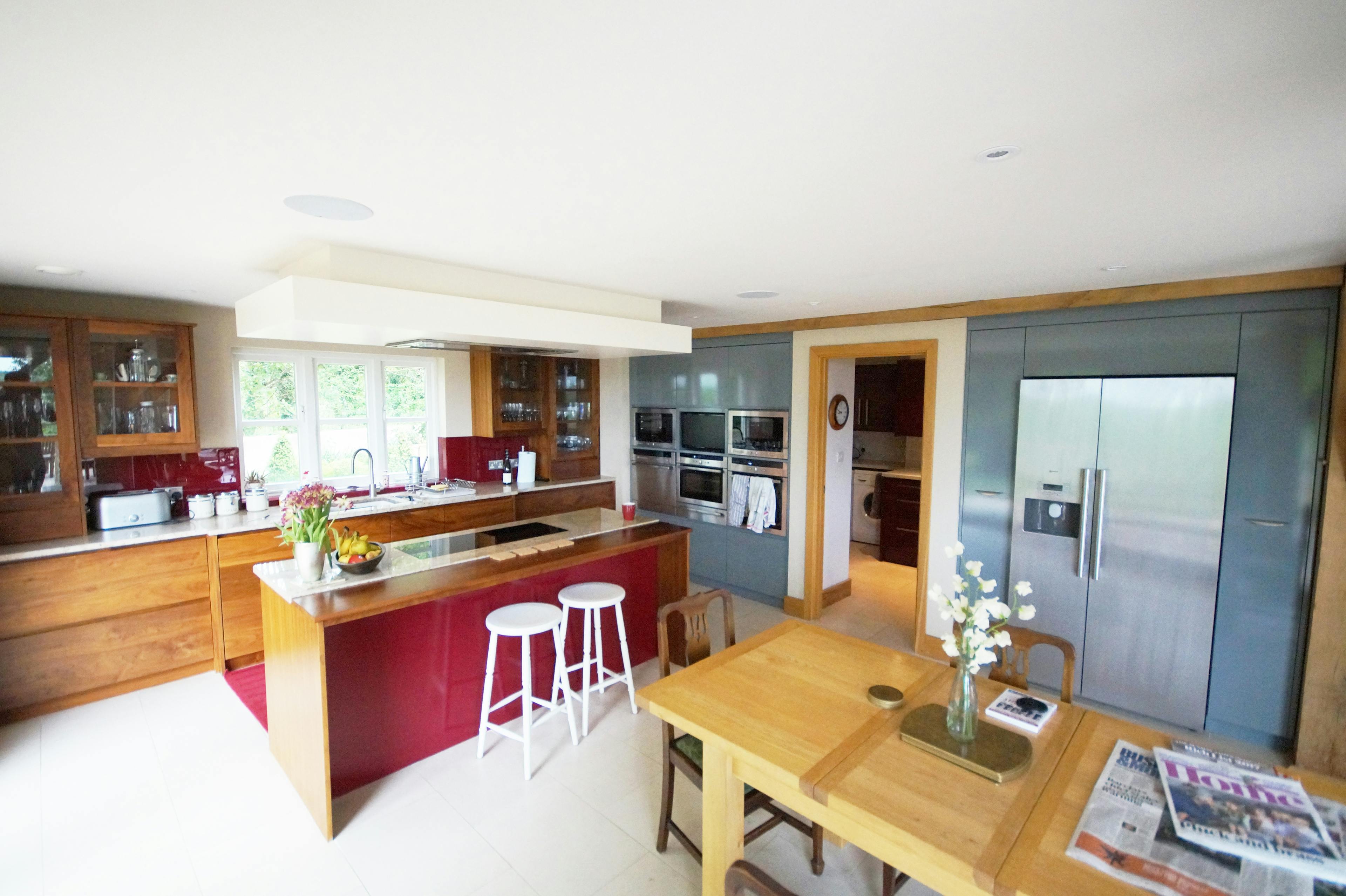 An oak framed kitchen dining room with island and breakfast bar