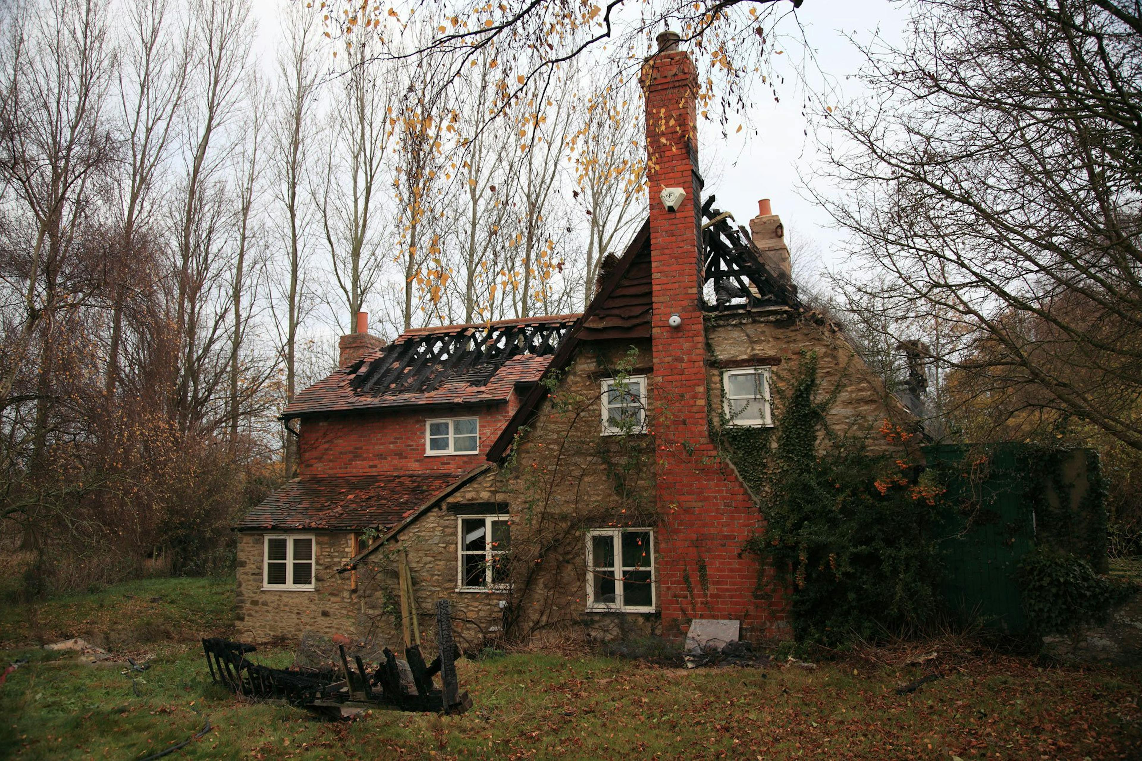 A fire-ravaged 16th-century thatched cottage