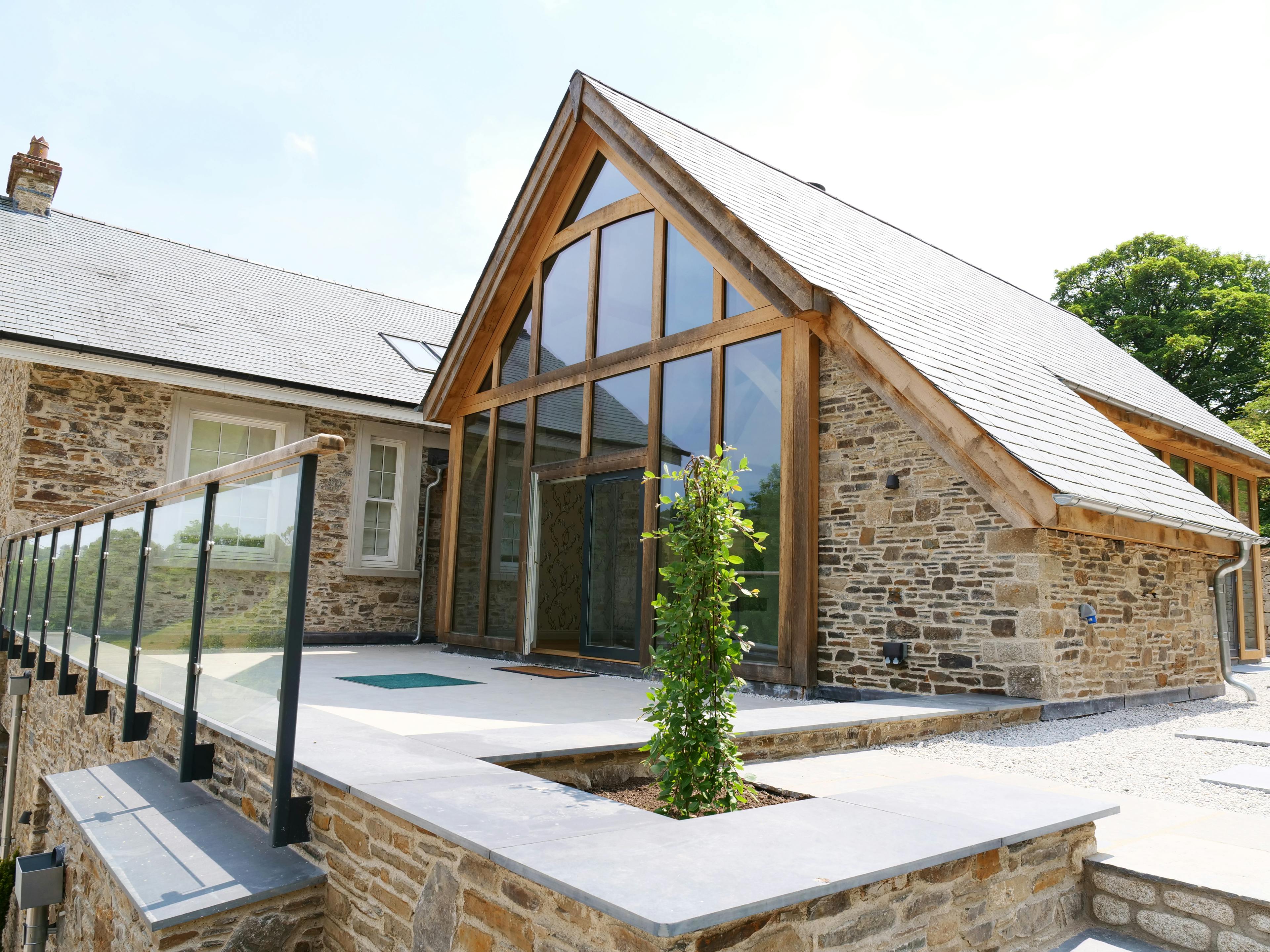 An oak framed extension to a stone farmhouse