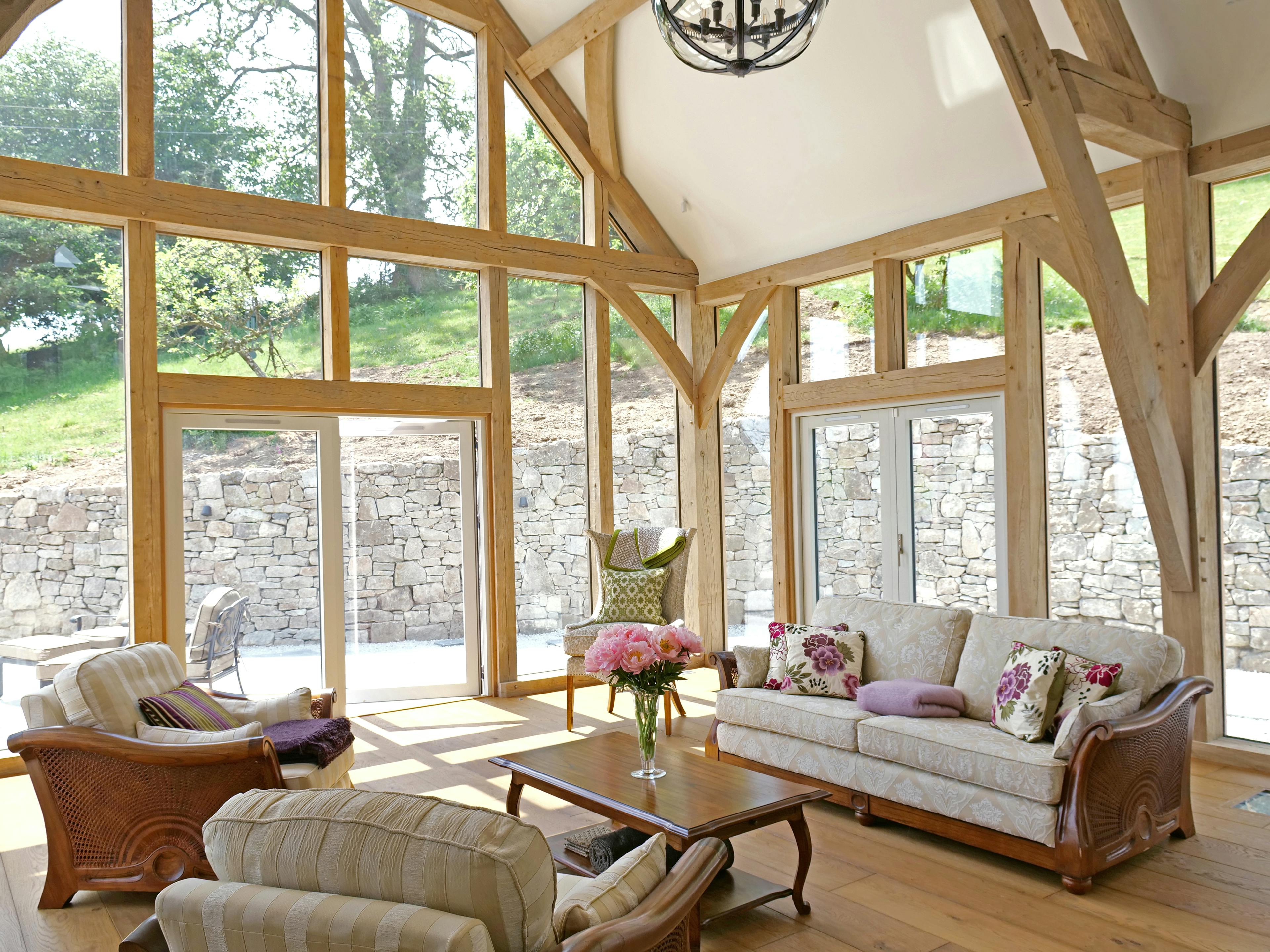 An oak framed extension with a sitting room and fire place