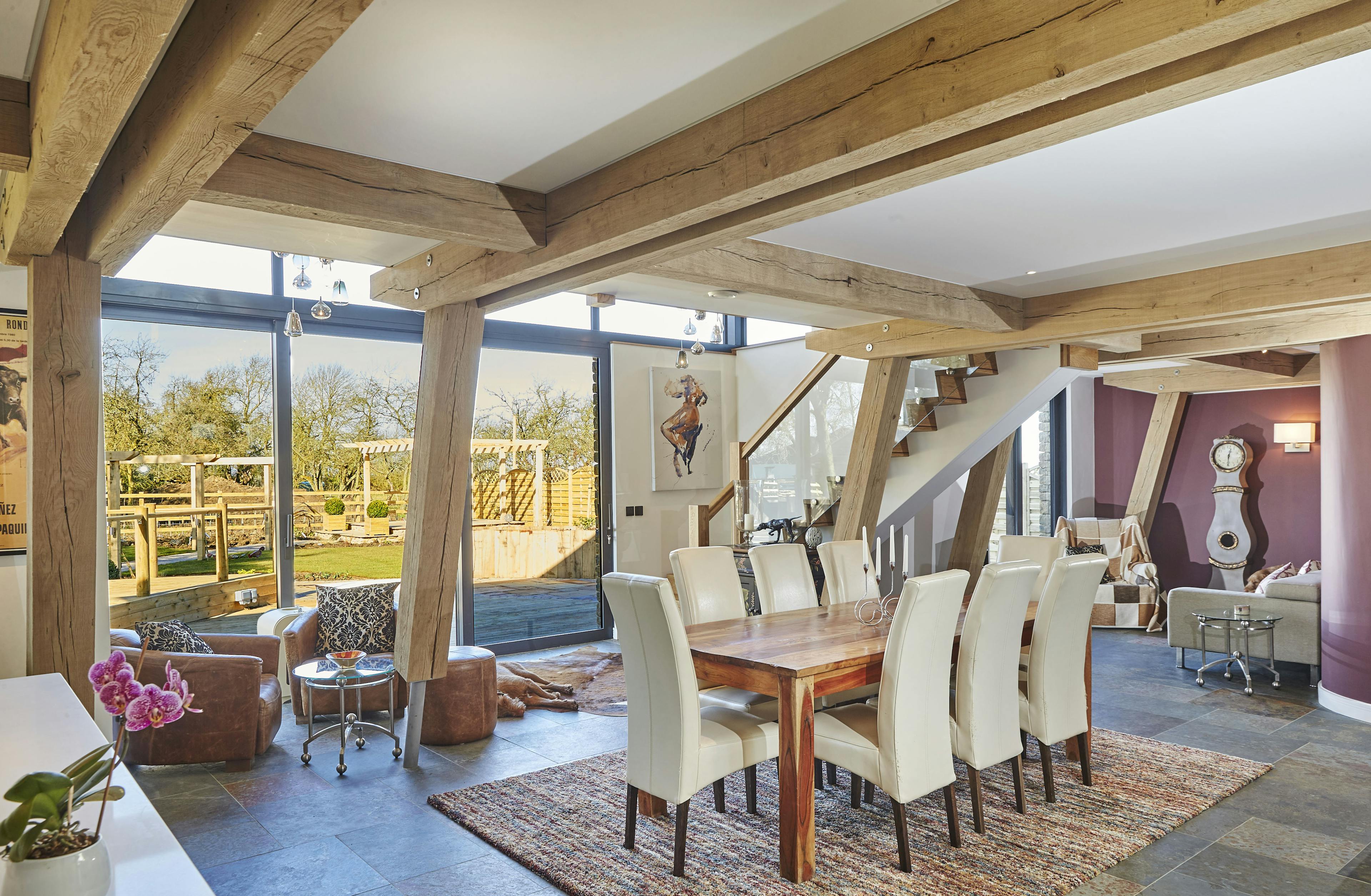 An open plan oak framed dining and sitting room