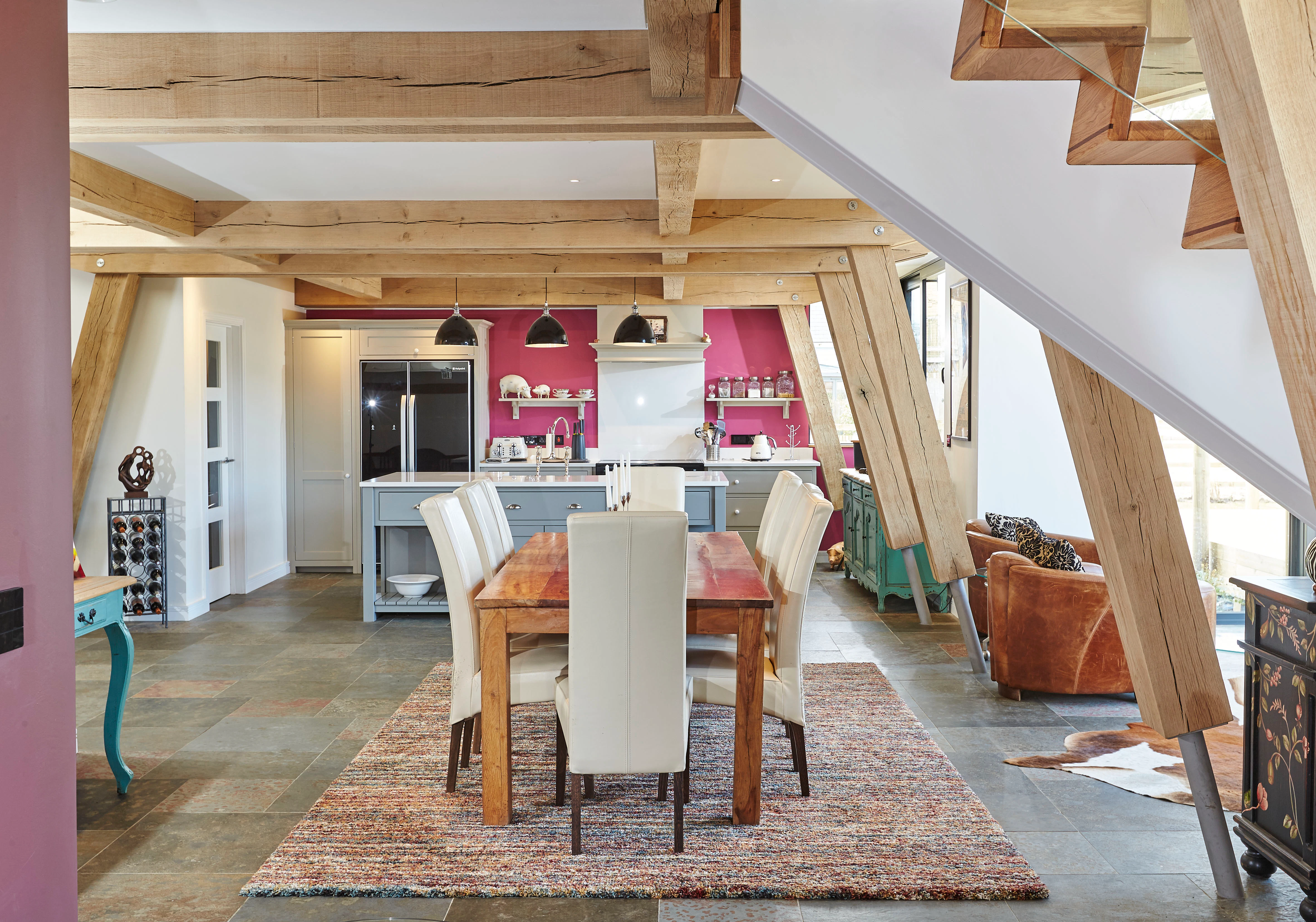 An open plan oak framed dining area and kitchen