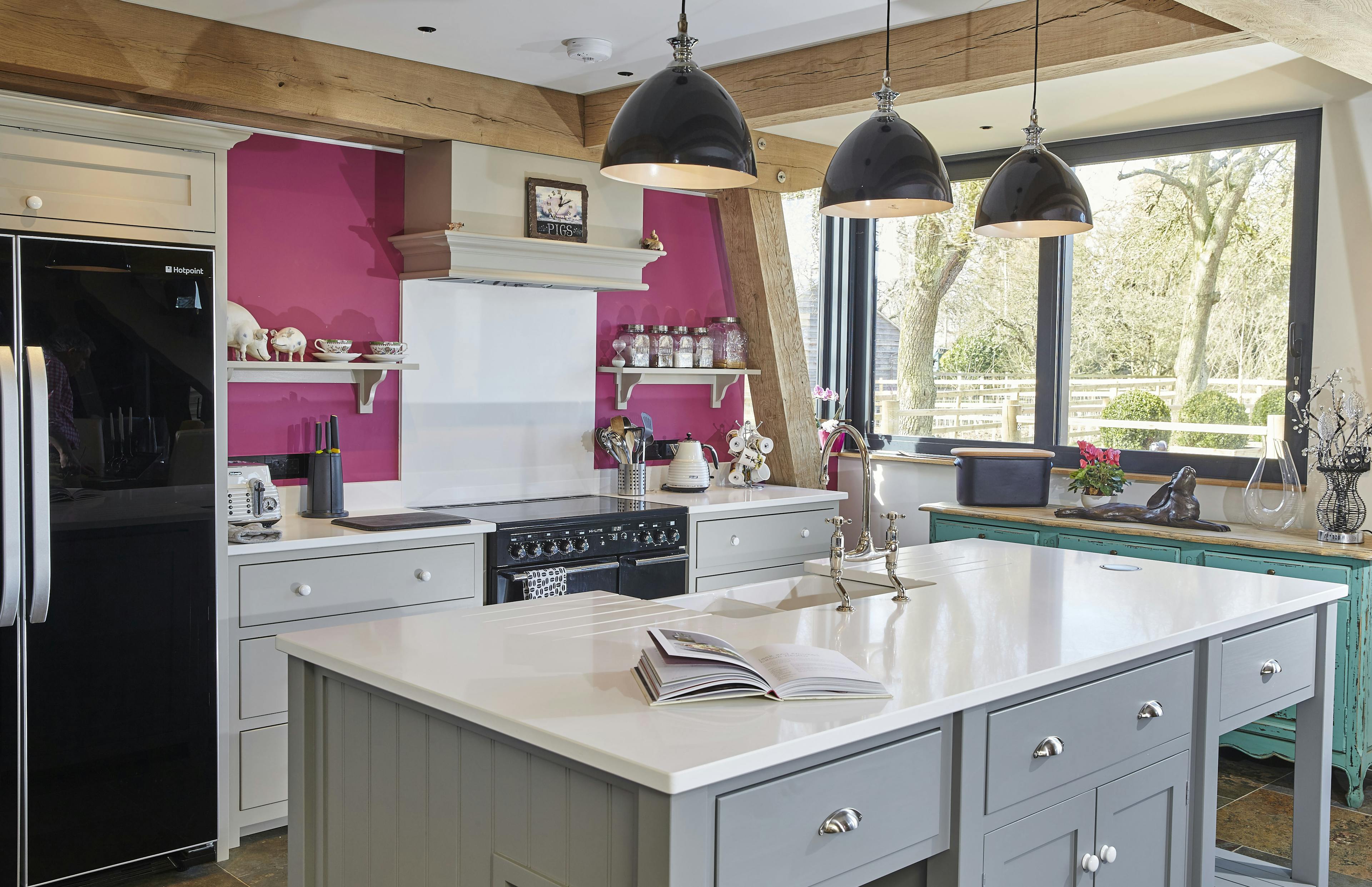 An oak framed kitchen with an island