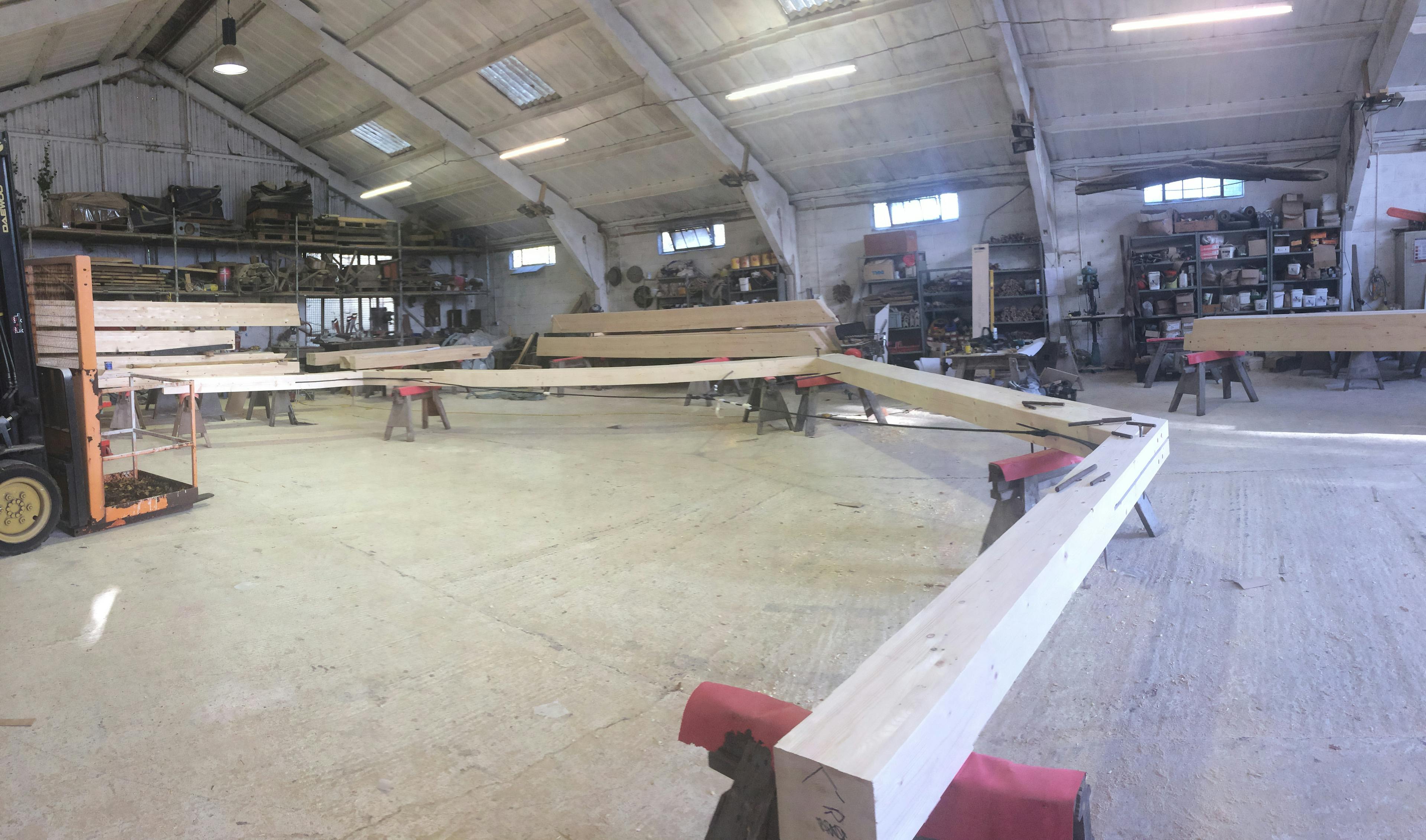A white spruce glulam frame in a carpenter's workshop