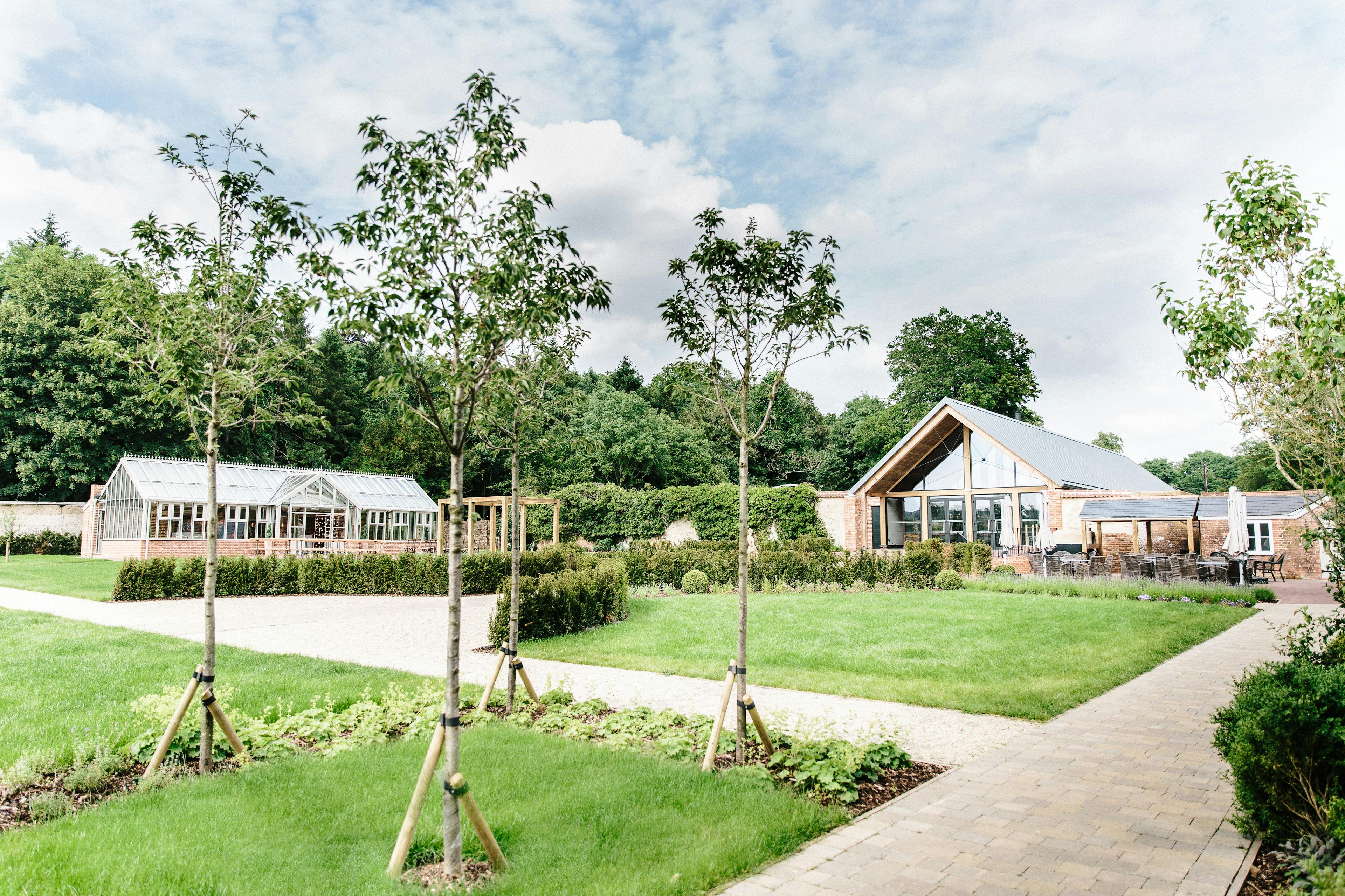 A timber white spruce glulam wedding barn in landscaped gardens