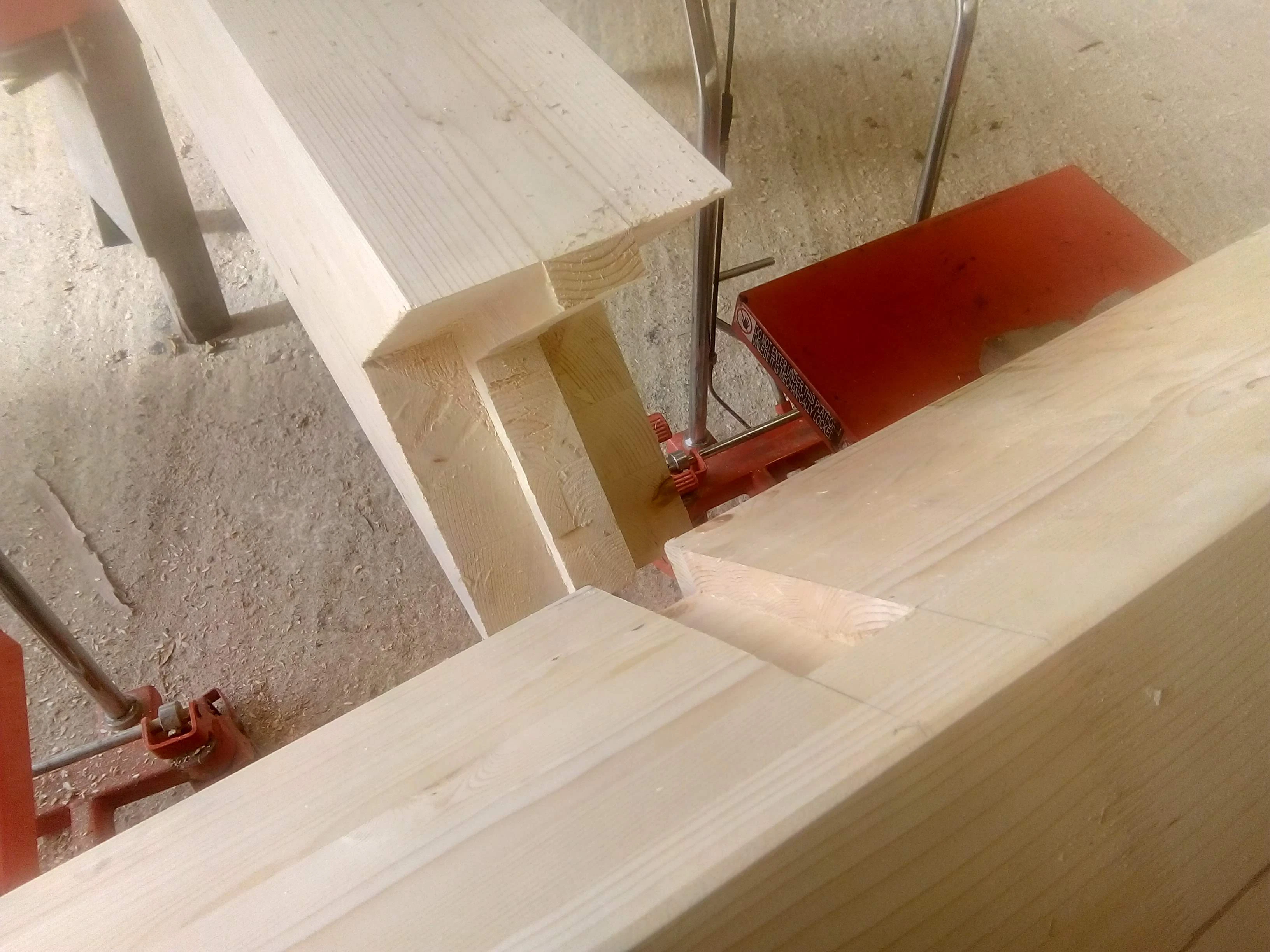 A white spruce glulam post in a carpenter's workshop